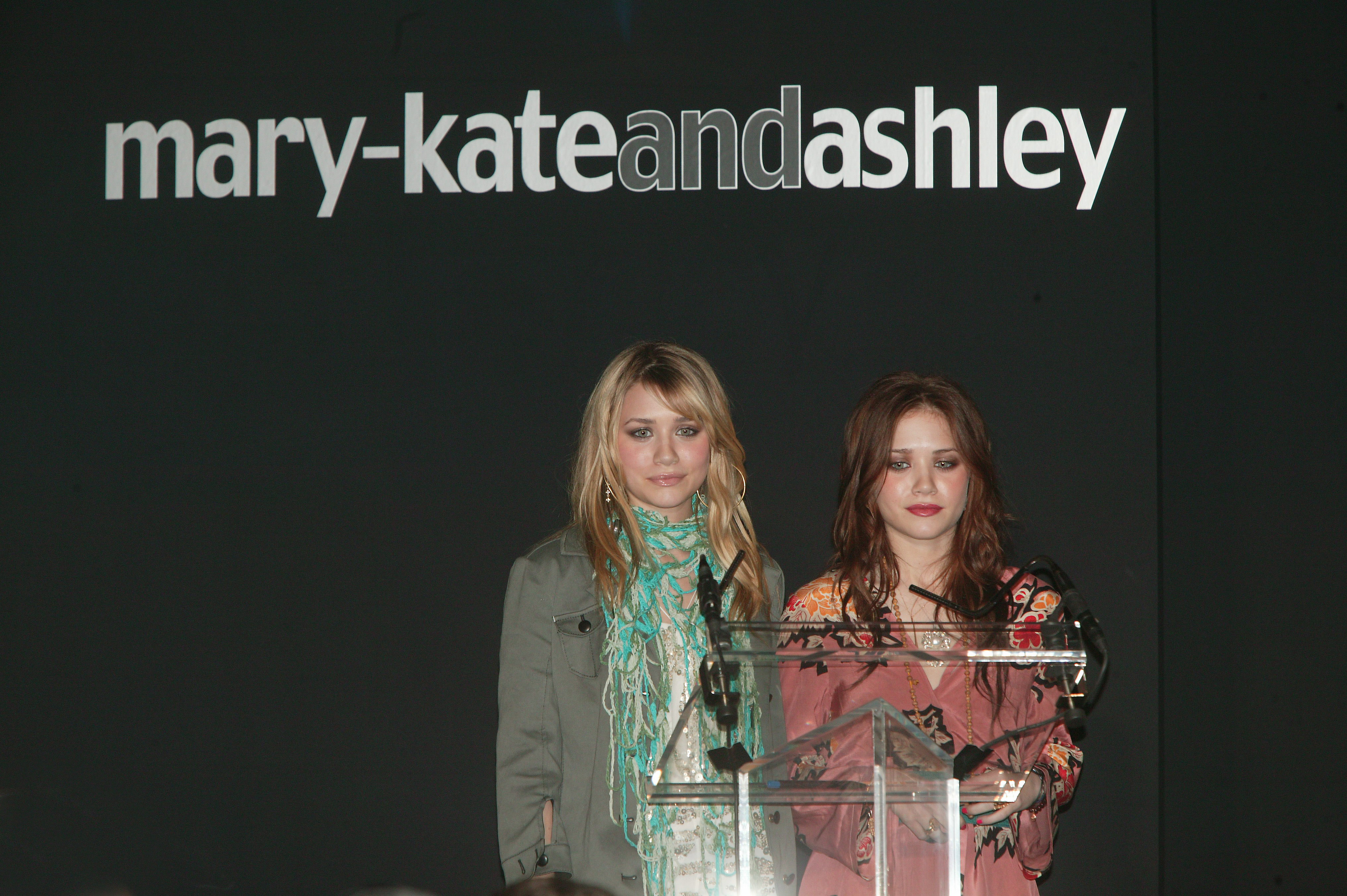Distinct styling and individual facial maturity marked the 17-year-old moguls on February 11, 2004, with Ashley keeping textured blonde locks under an olive utility jacket while Mary-Kate shifted to rich auburn-brunette waves, framing a narrower face in an embroidered peasant tunic.