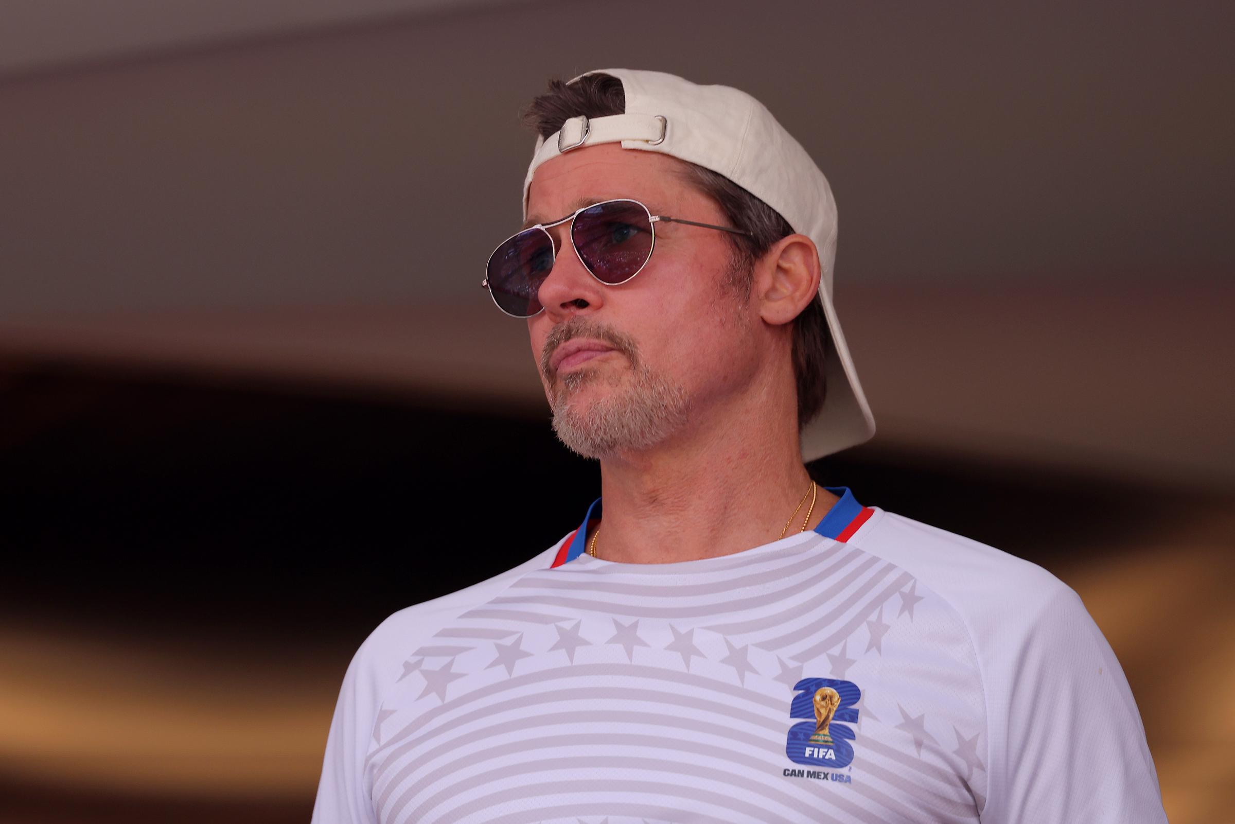 Brad Pitt pictured at a public appearance in July 2026, sporting a casual look and a FIFA-branded shirt as he stepped into the spotlight during a busy year for the actor. | Source: Getty Images