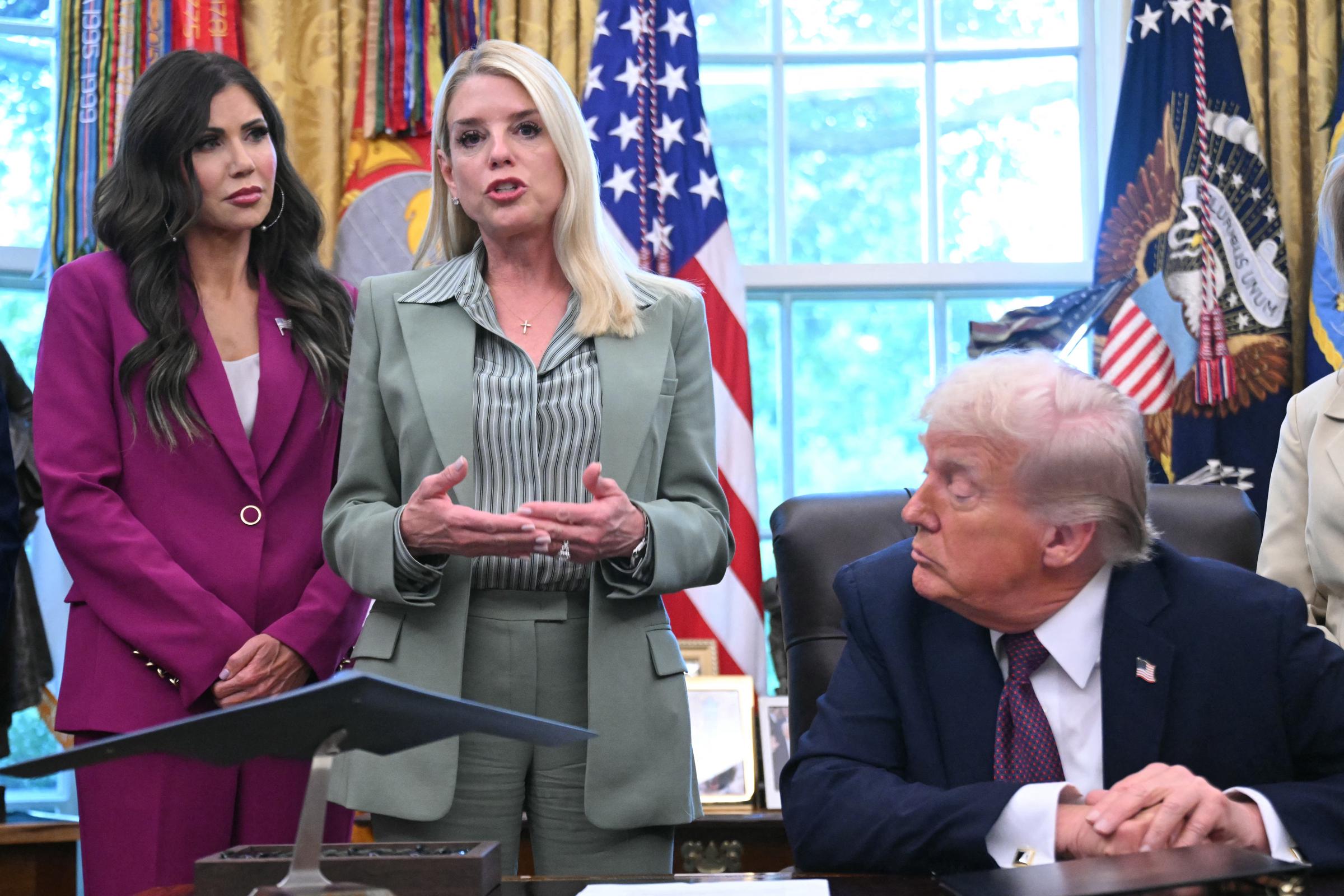 Pam Bondi speaks as President Donald Trump listens during a signing event in the Oval Office at the White House in Washington, D.C., on September 15, 2025 | Source: Getty Images