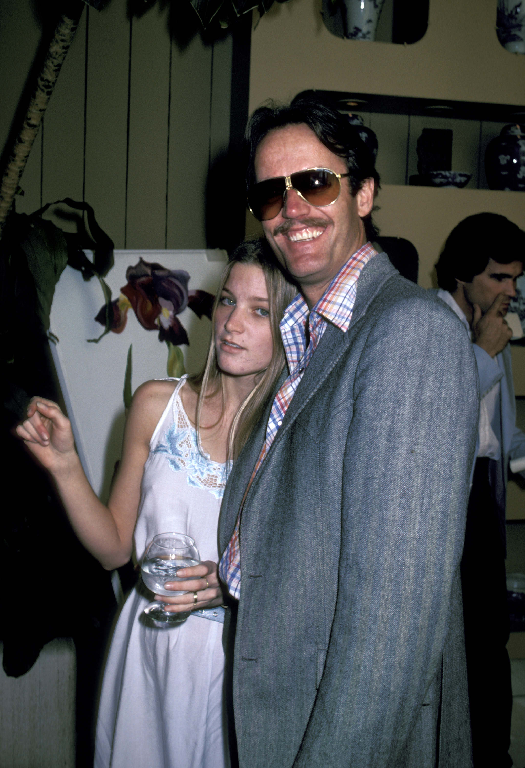 Bridget Fonda with her father, Peter Fonda, during Heidi Hagman’s Art Exhibit at the Arthur Elrod Showroom in Palm Springs, California. Her family name carried enormous Hollywood weight, but Bridget carved out a screen identity of her own across an unusually eclectic range of roles. | Source: Getty Images