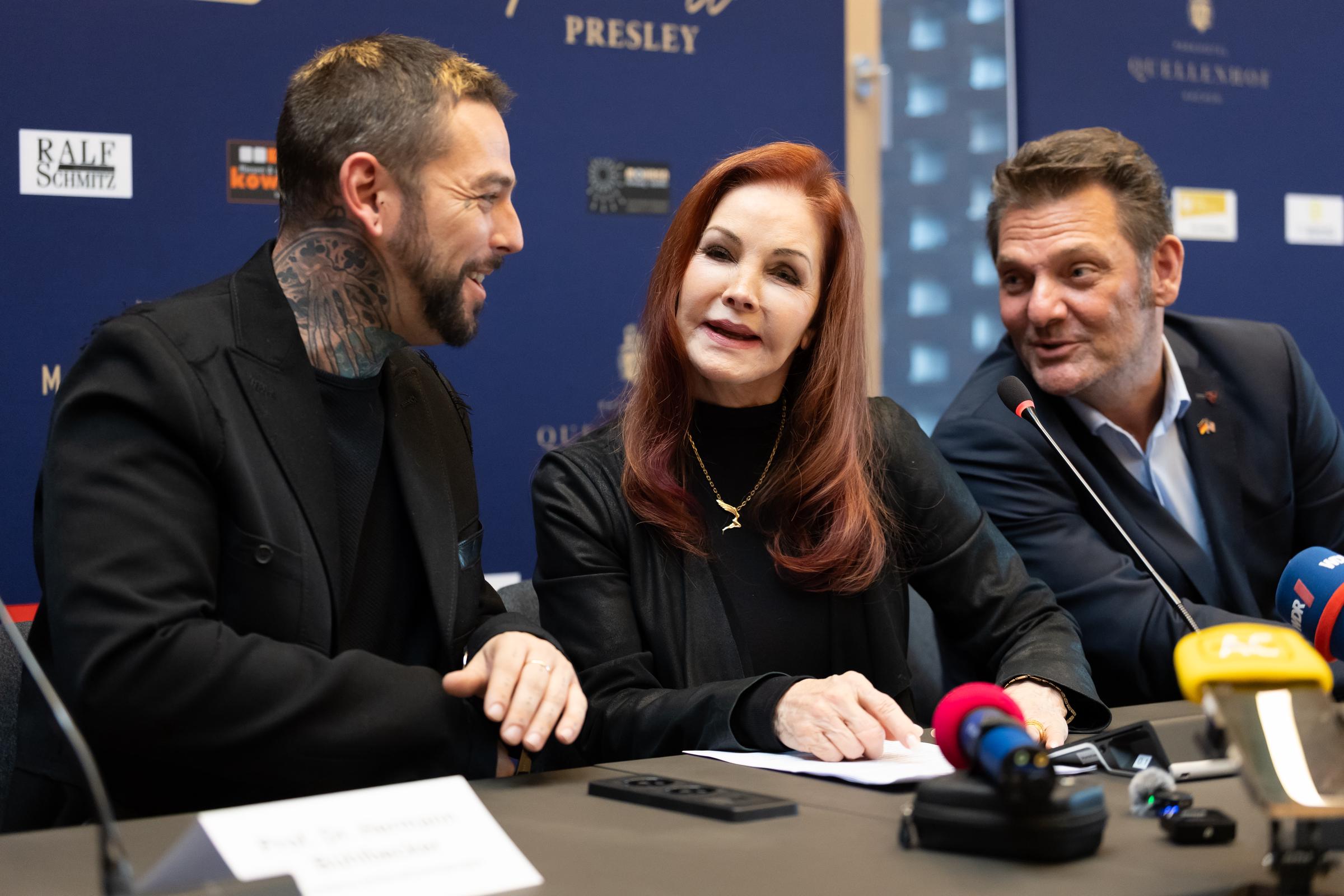 Priscilla Presley visited Baesweiler, Germany, on October 20, 2026, ahead of a special event celebrating her life with Elvis Presley. The 81-year-old signed the town's Golden Book and introduced her son to the crowd during the engagement. | Source: Getty Images