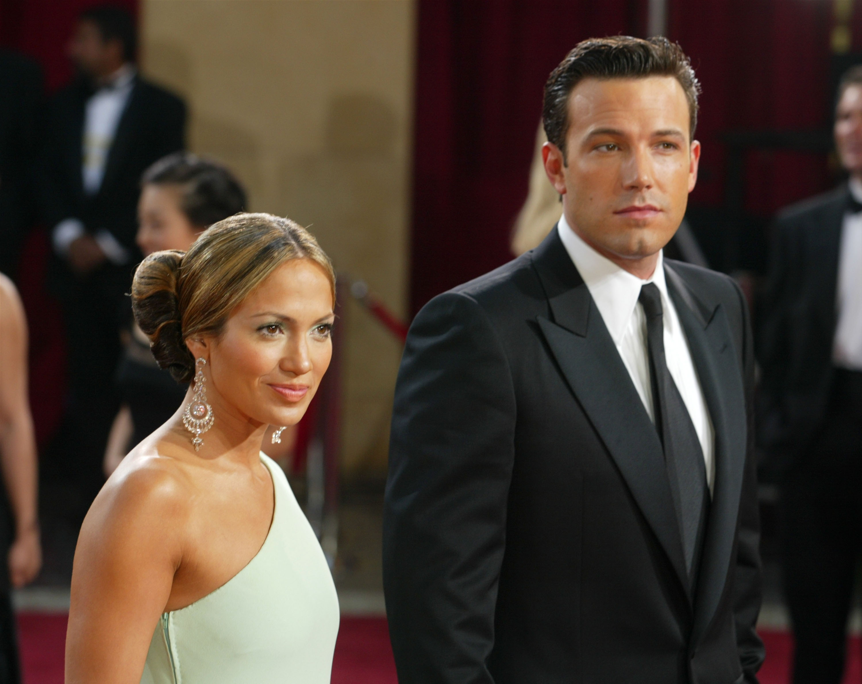 Jennifer Lopez and her then-fiance Ben Affleck attended the 75th Annual Academy Awards at the Kodak Theater in Hollywood, California. Dressed in a sleek, one-shoulder mint green gown with hair styled in a polished low bun with a soft side part, Jennifer Lopez radiated classic Hollywood elegance.