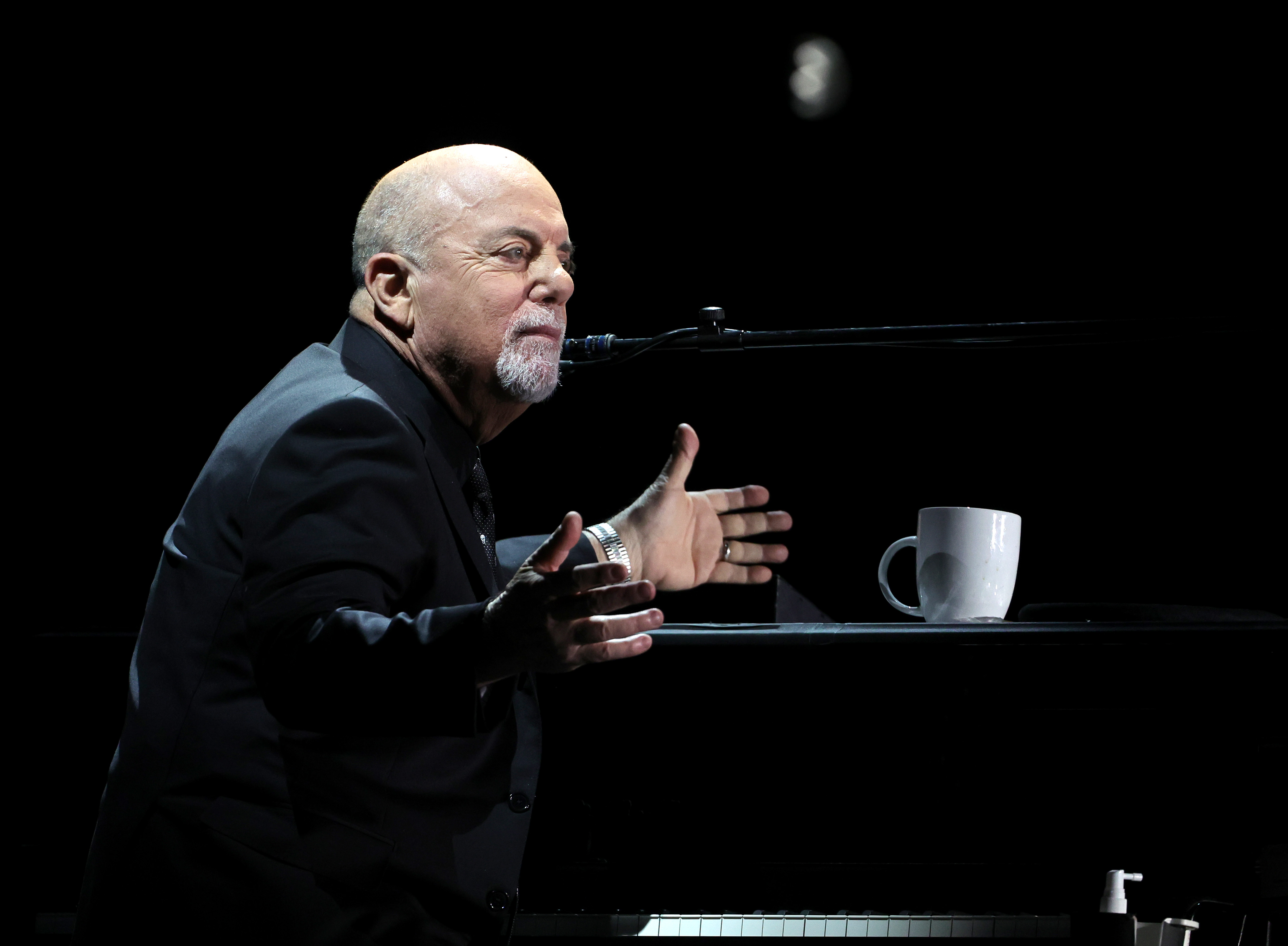 Billy Joel performs at Allegiant Stadium in Las Vegas on Feb. 26, 2022. He later canceled his upcoming concerts because of his health, and has since spoken publicly about the condition and treatment that followed. | Source: Getty Images