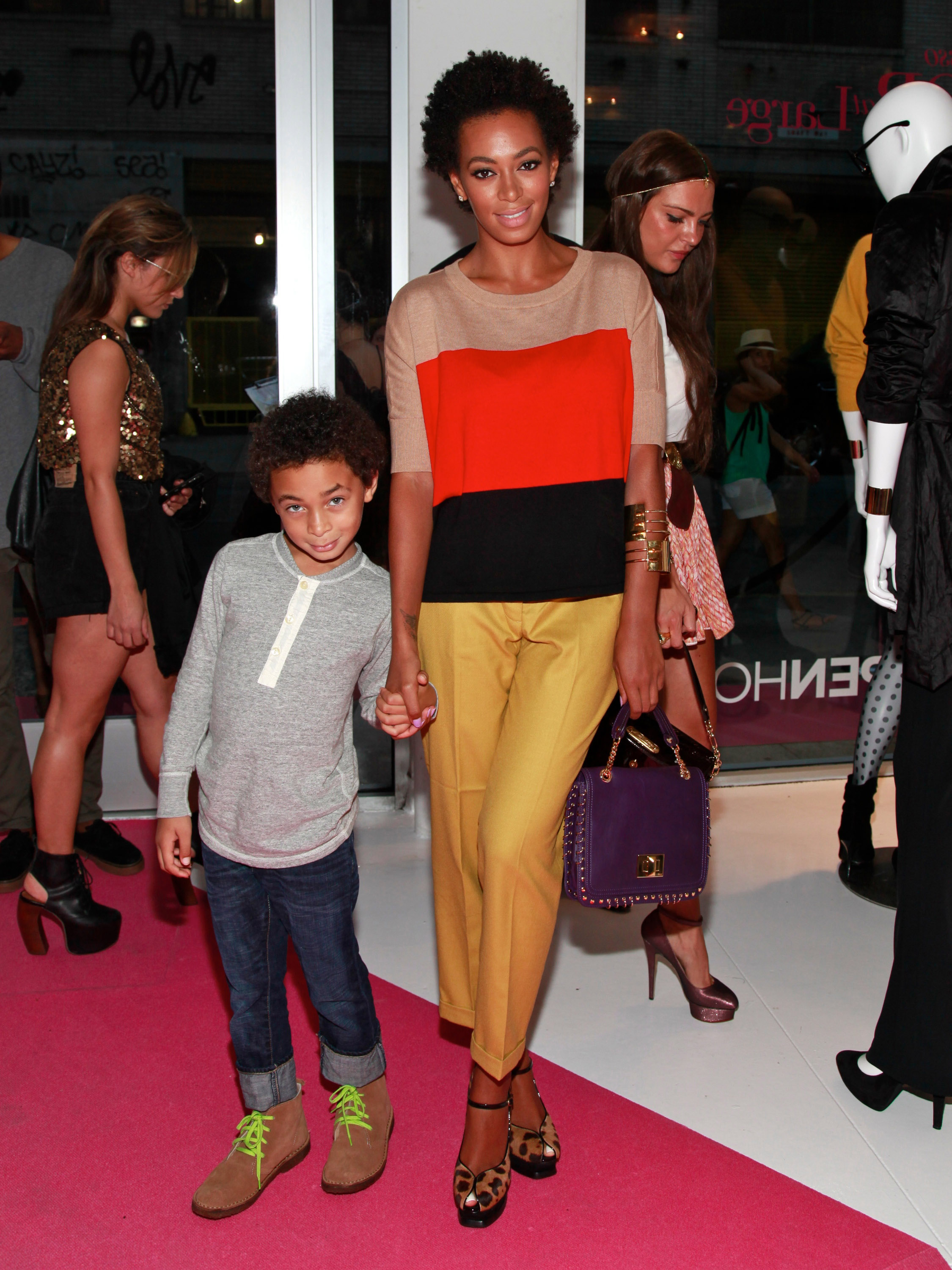 Julez Smith and his mother Solange Knowles attend the INC International Concepts announcement at Open House Gallery on August 17, 2011 | Source: Getty Images