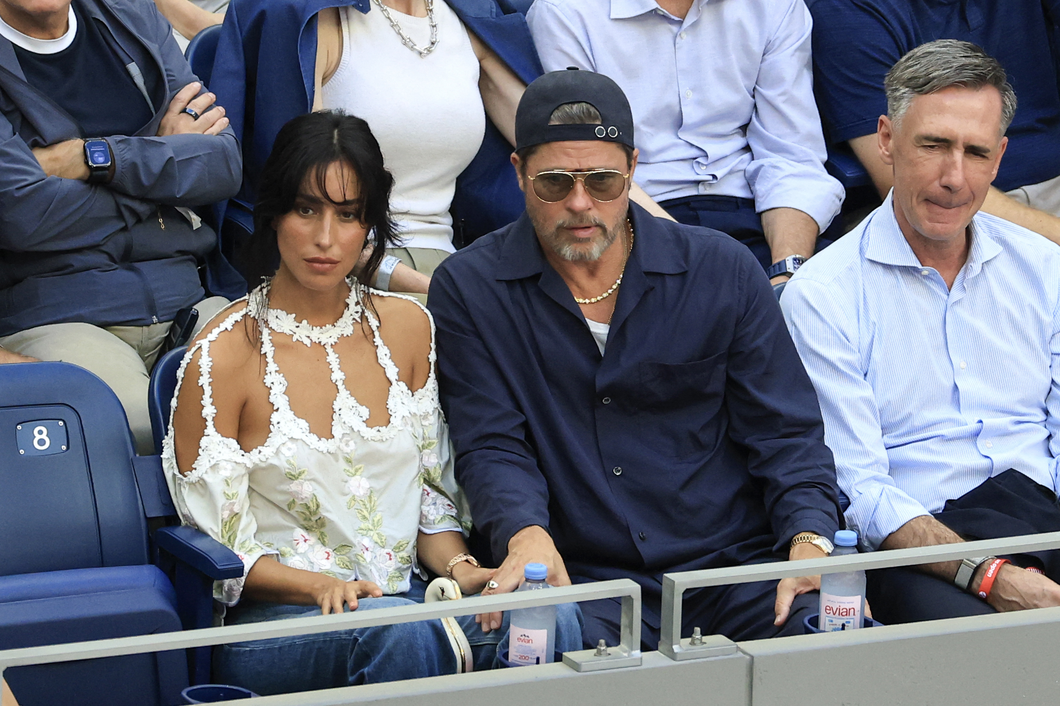 Pitt and de Ramon held hands as they watched the men's final from their seats. The affectionate moment came nearly a year after a source told People that the couple was "happier than ever" and "going really strong."
