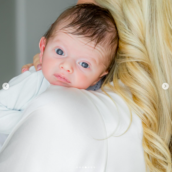 Alexander Trump Boulos staring at the camera as his mother, Tiffany Trump, holds him. | Source: Instagram/tiffanytrump