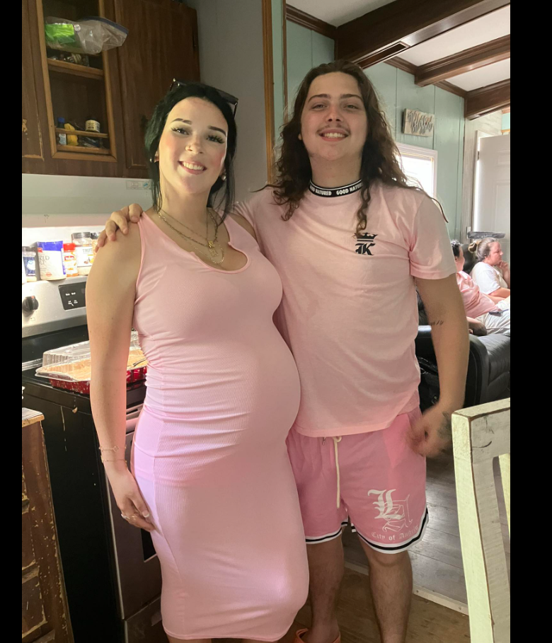 Keziah Luker and a loved one couple stands close together in a cozy kitchen, both dressed in coordinated pink outfits. | Source: Facebook/Keziah Luker