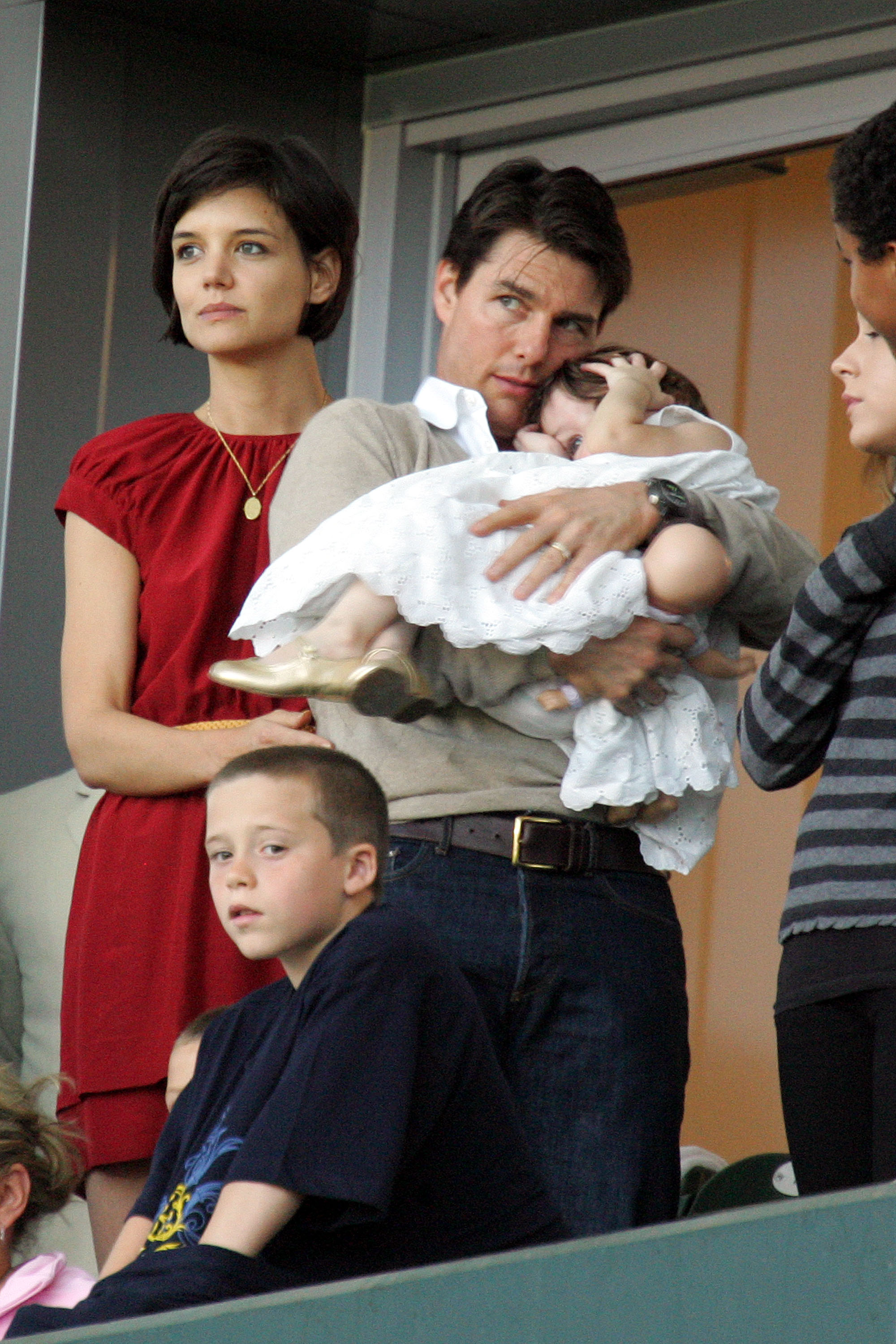 David Beckham's son Brooklyn Beckham (front), actors Tom Cruise and Katie Holmes, with their daughter Suri, watch a Major League Soccer match on May 10, 2008 in Carson, California | Source: Getty Images