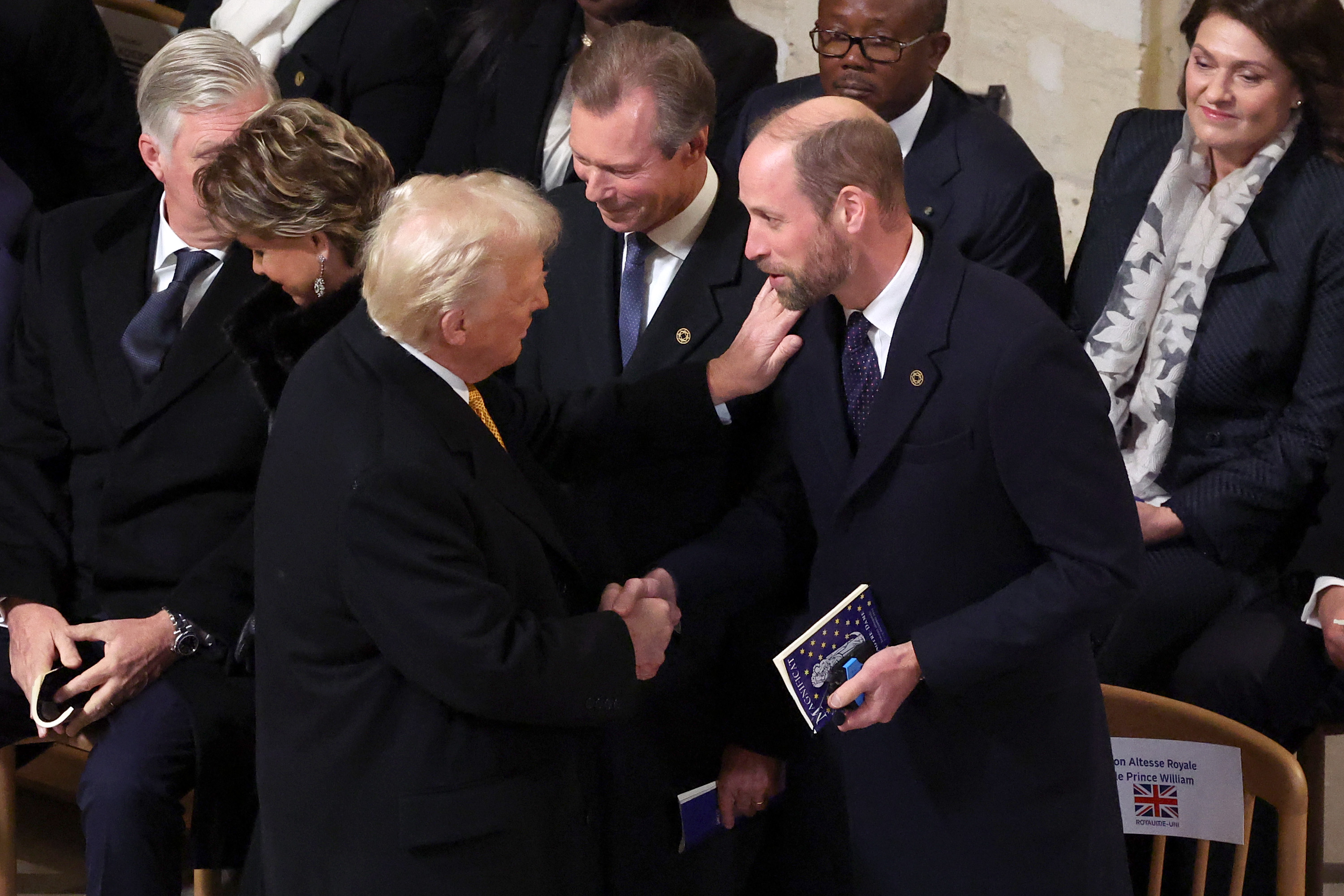 Donald Trump greets Prince William, Prince of Wales, during the ceremony to mark the reopening of Notre-Dame of Paris Cathedral on December 7, 2024, in Paris, France | Source: Getty Images