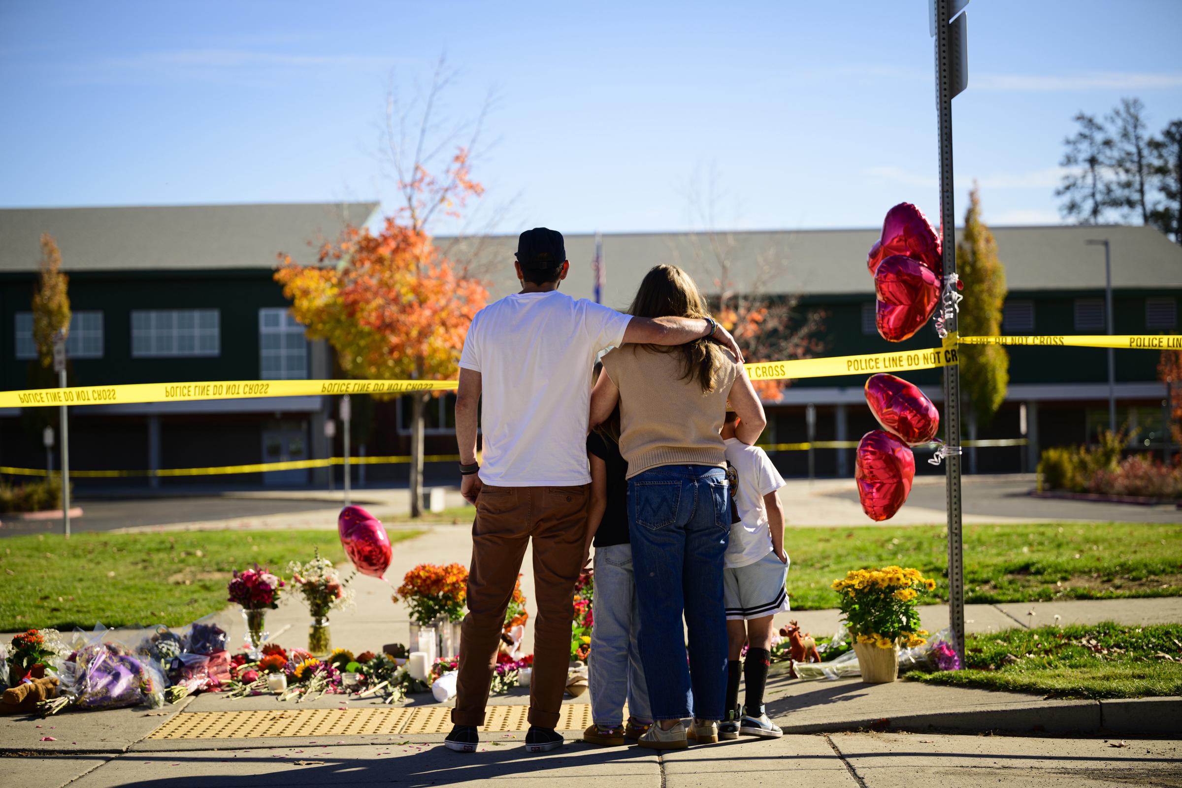 As families gathered outside Silver Rail Elementary, the school remained closed following the shooting. District officials began arranging alternative classrooms so children could continue their education. | Source: Getty Images