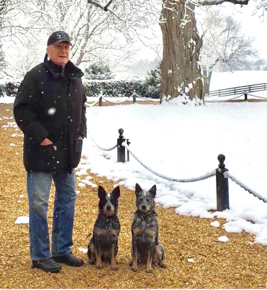 Robert Duvall posing for a photo alongside two dogs, posted on December 12, 2017. | Source: Facebook/Robert Duvall