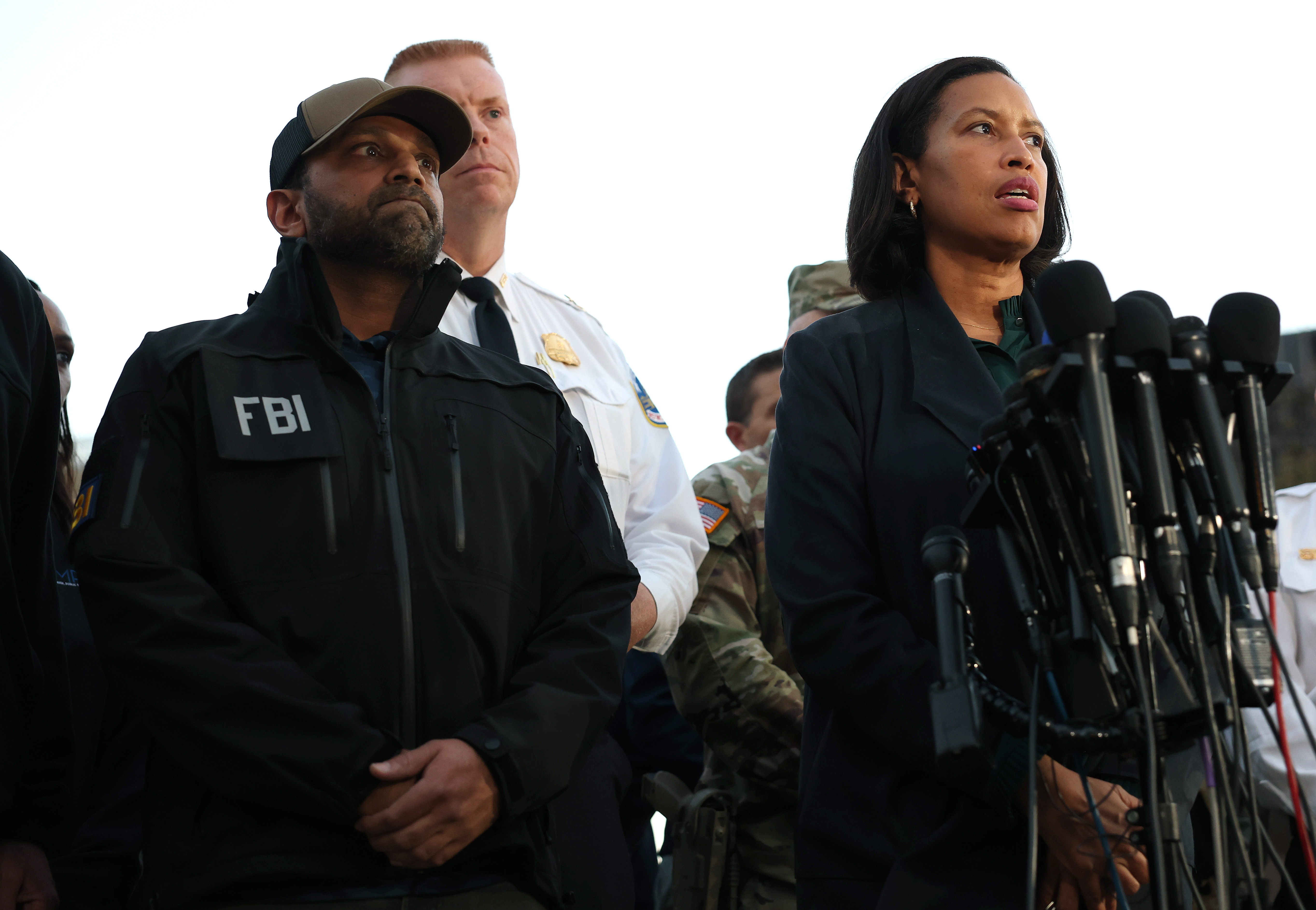 FBI Director Kash Patel and D.C. Mayor Muriel Bowser address the media following the shooting of two National Guardsmen in downtown Washington, on November 26, 2025 | Source: Getty Images