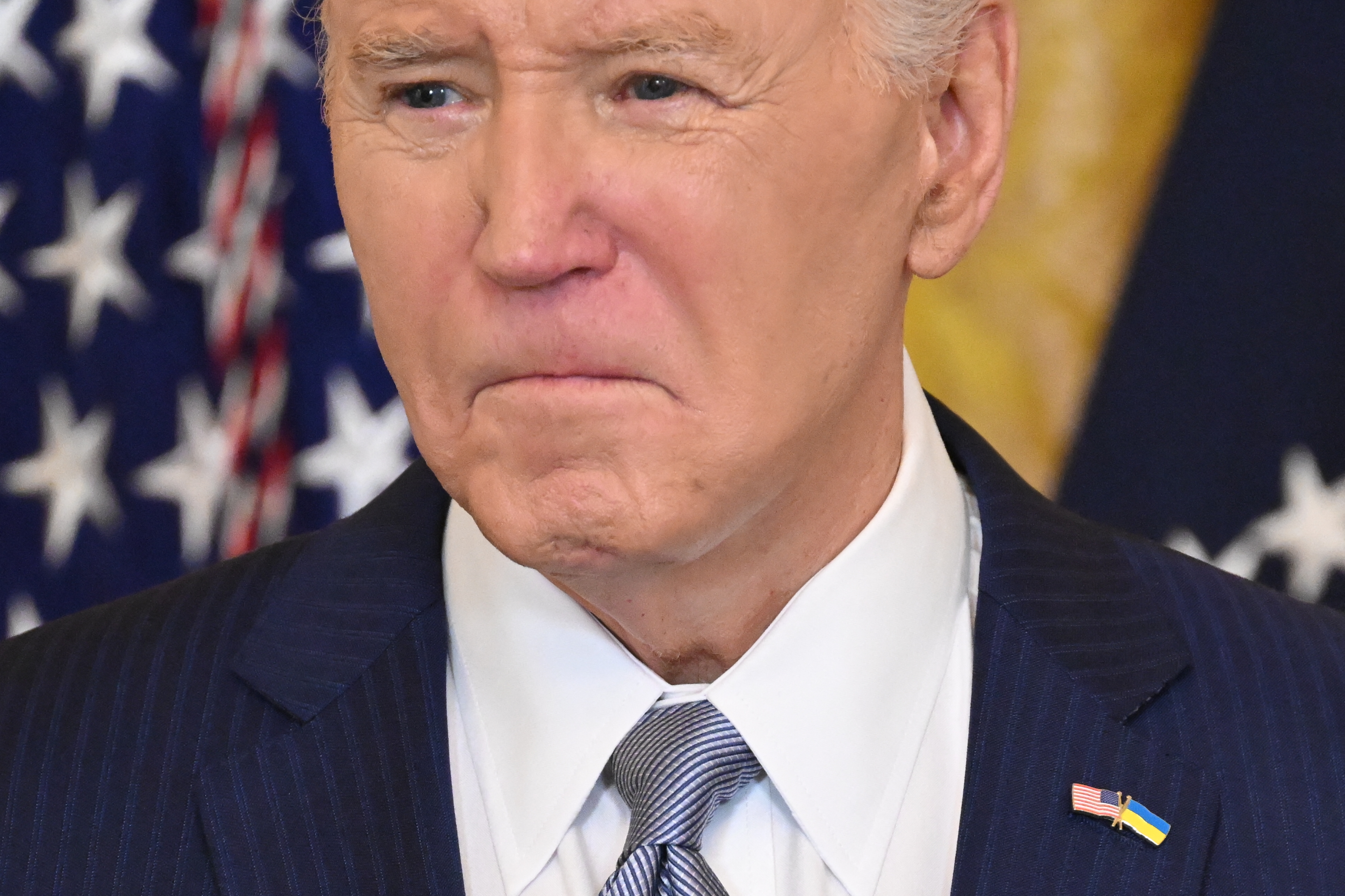 Joe Biden pauses during his speech to a bipartisan group of governors in the East Room of the White House in Washington, DC, during the National Governors Association Winter Meeting, on February 23, 2024. | Source: Getty Images