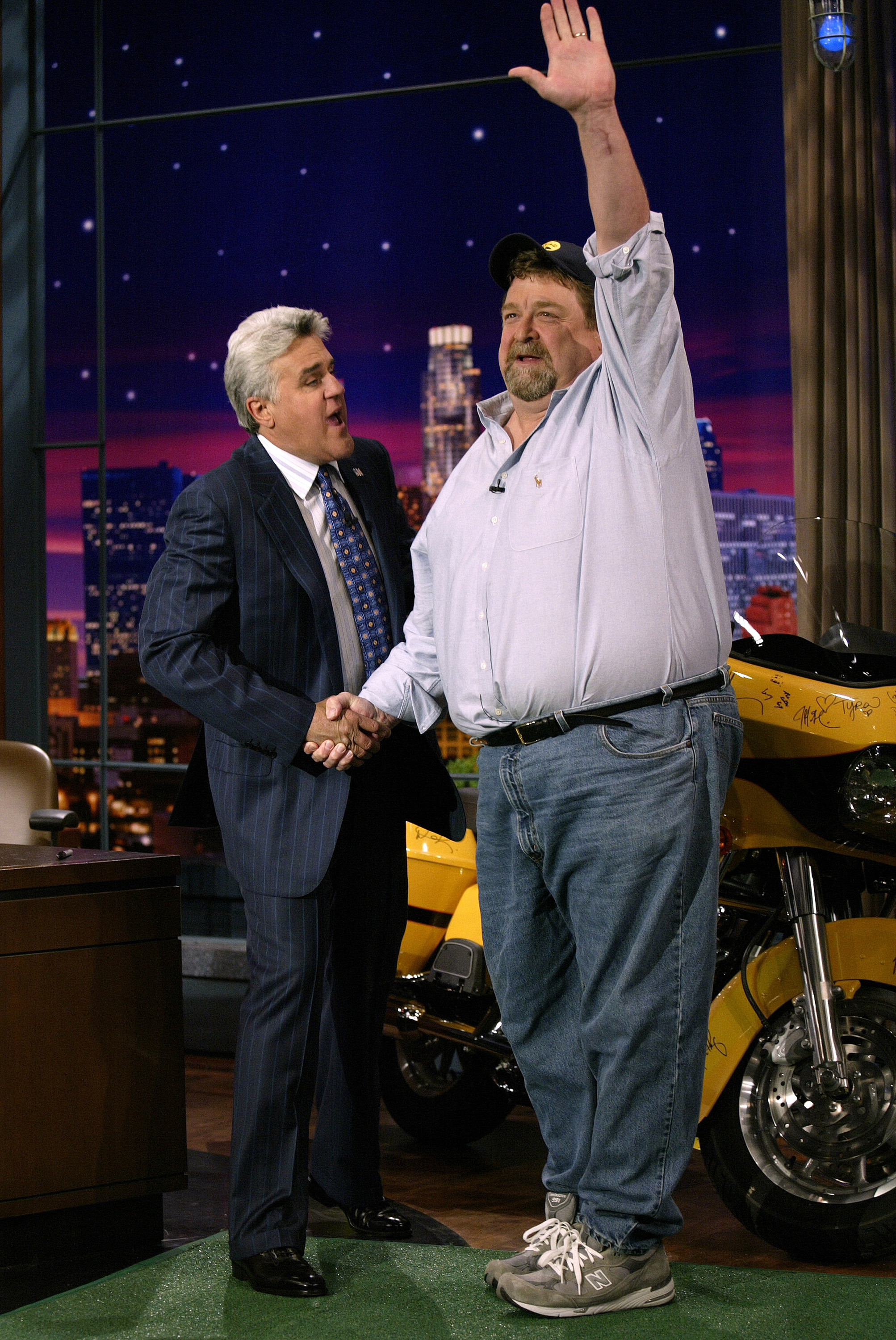 John Goodman joins Jay Leno on The Tonight Show in September 2005, sharing a lighthearted moment on the set. | Source: Getty Images