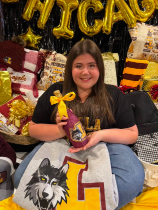 Sheridan Gorman smiling and posing with Loyola University Chicago branded objects. | Source: GoFundMe/Sheridan Gorman Memorial & Scholarship Fund