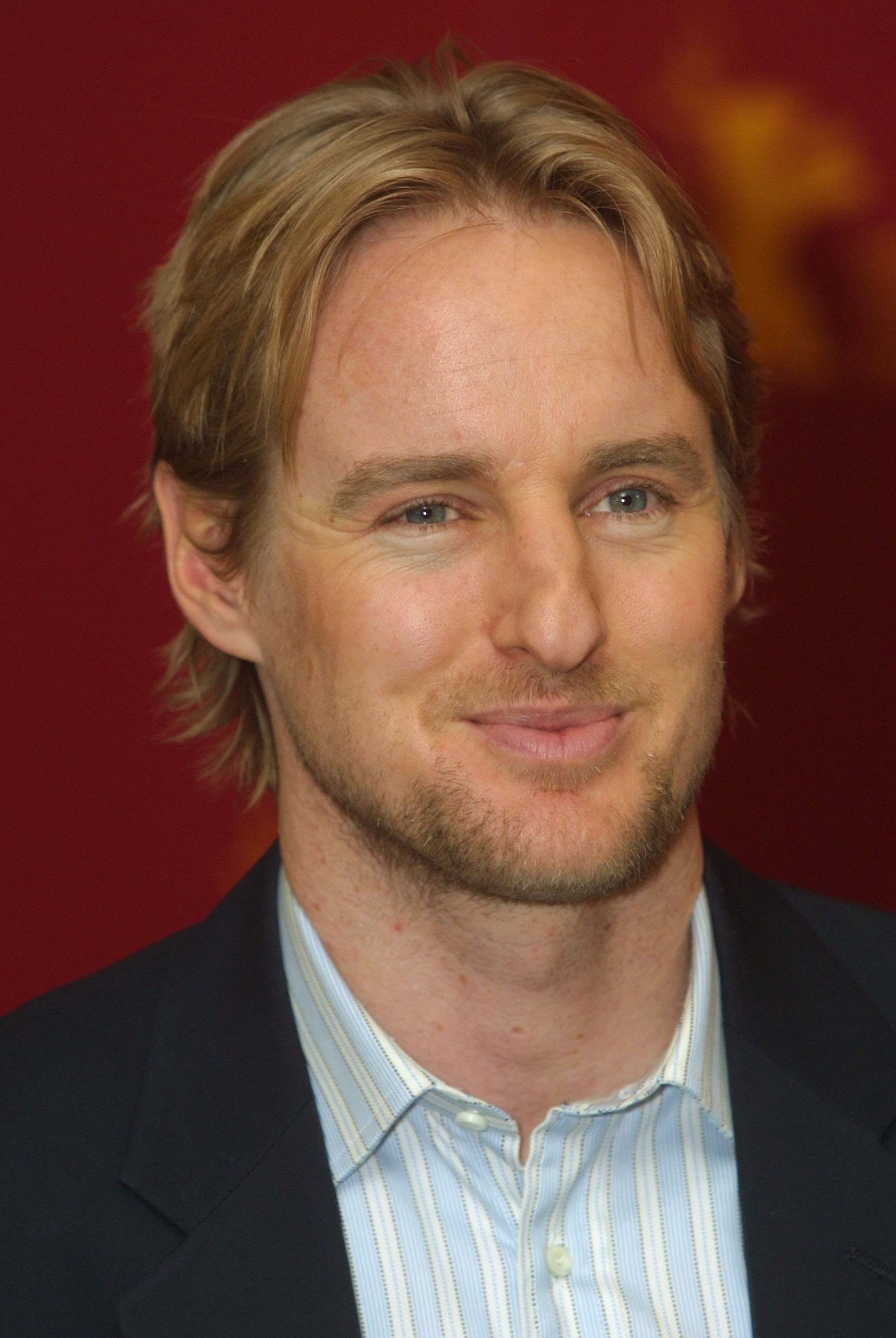Owen Wilson arrived at the Berlinale Film Festival in Berlin, Germany, on February 13, 2002, smiling for photographers in a close-up portrait. His blond hair, blue eyes, and distinctive facial features would later become points of comparison as photos of his daughter, Lyla, prompted netizens to remark on how closely they believed she resembled her father.