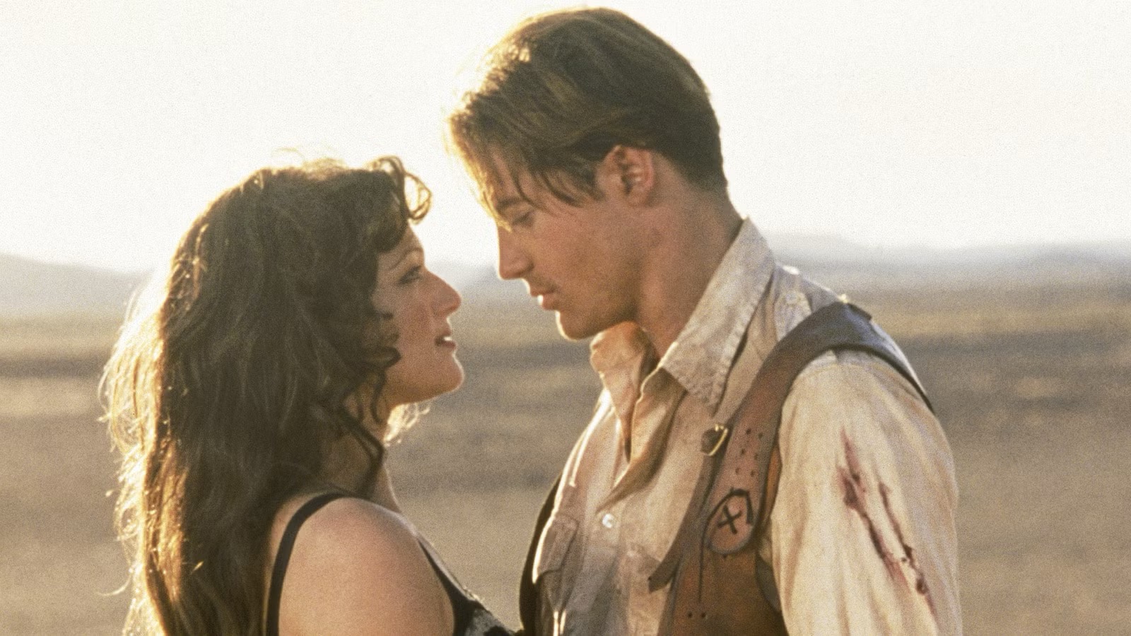 Brendan Fraser and Rachel Weisz sharing a romantic moment as Rick and Evelyn in "The Mummy" (1999). Their on-screen chemistry became a fan favorite, with the actors reuniting for the franchise 27 years later. | Source: Getty Images