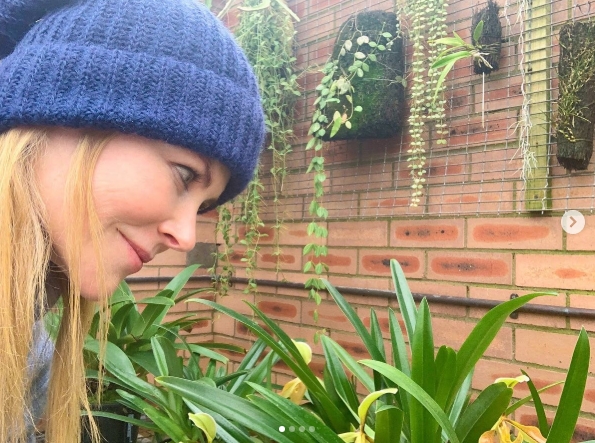Lush greenery thrives in a charming corner of the property, where hanging planters and leafy tropicals line a brick wall, adding warmth and texture to the outdoor garden space. From a post dated April 22, 2021. | Source: Instagram/nicolekidman