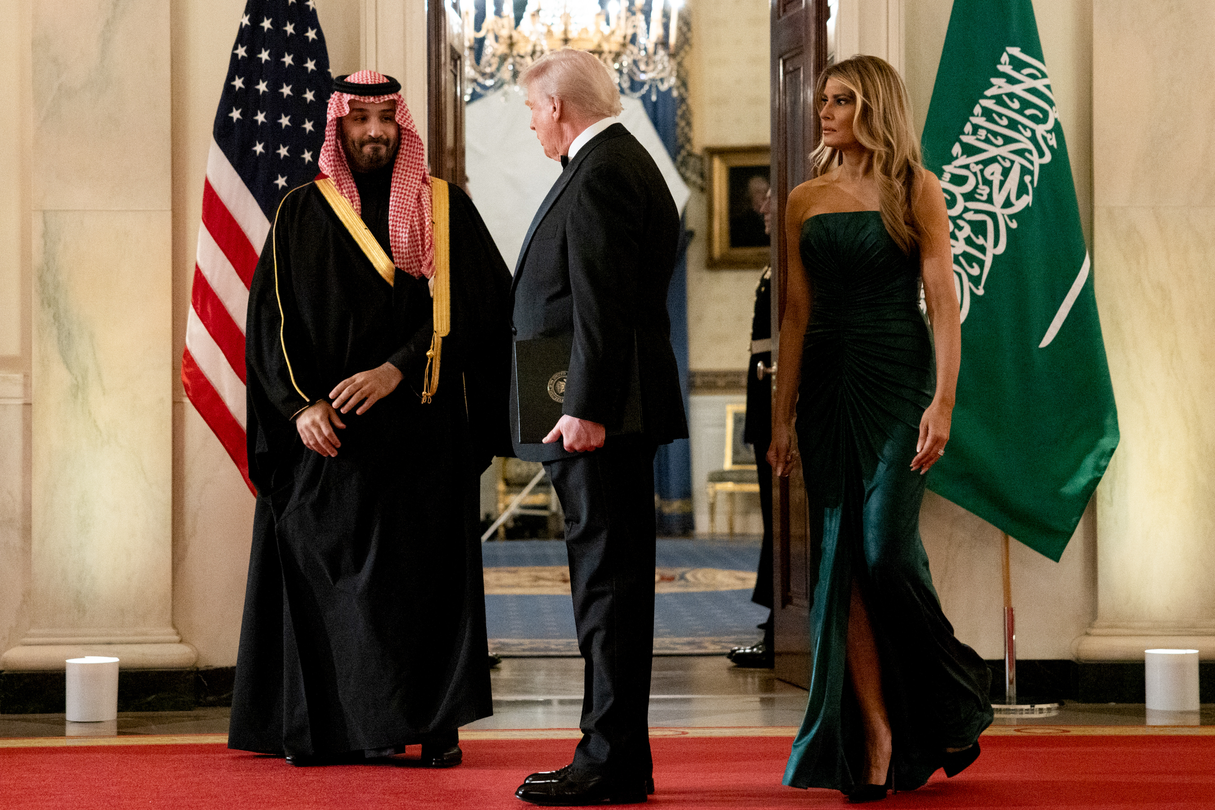 Mohammed bin Salman, US President Donald Trump and First Lady Melania Trump arrive for a dinner in the East Room of the White House on November 18, 2025, in Washington, DC | Source: Getty Images