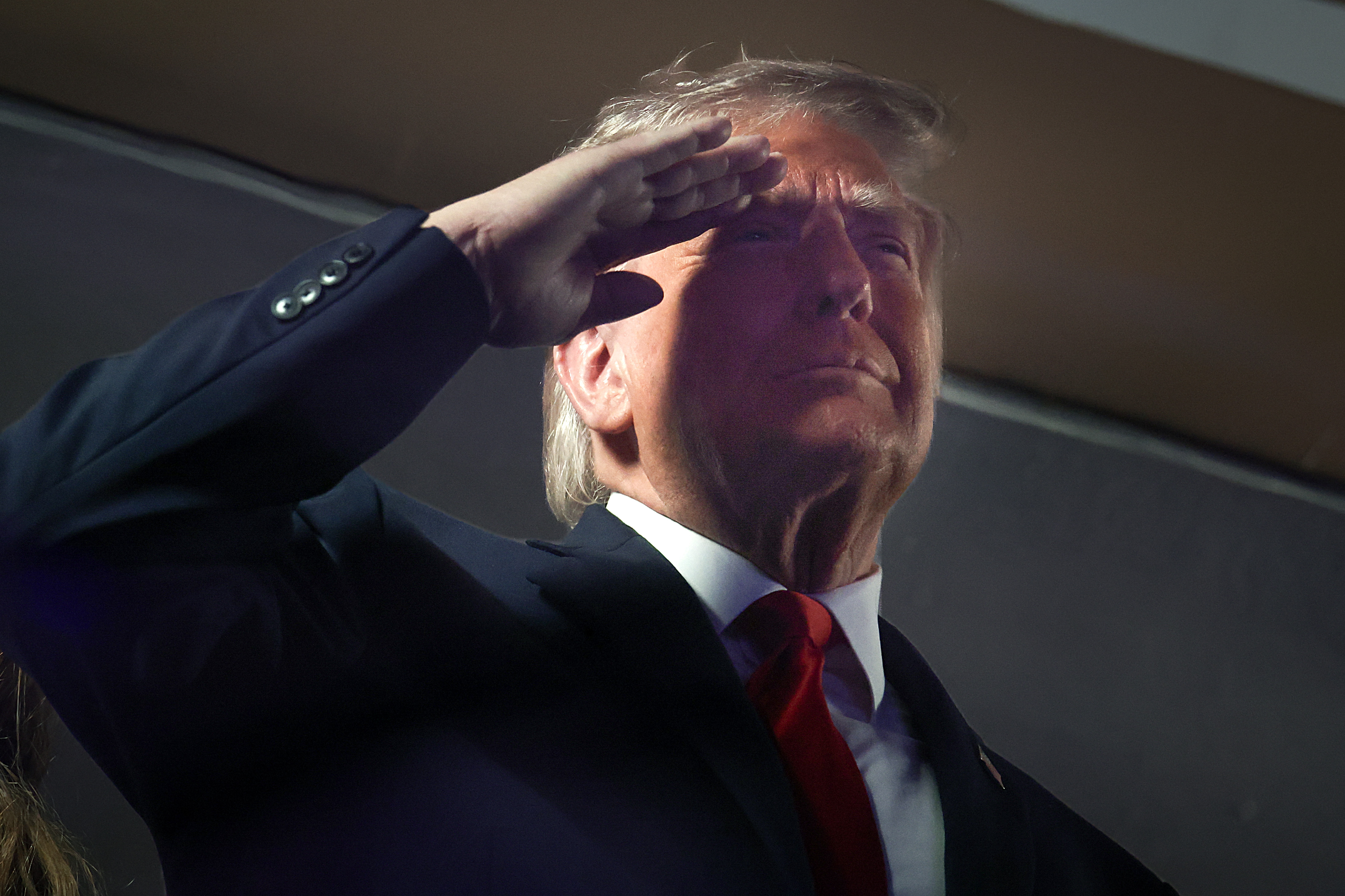 Donald Trump salutes during the national anthem before Game 3 of the NBA Finals at Madison Square Garden in New York City. The president's appearance drew a mixed reaction from the crowd, becoming one of the night's most talked-about moments. | Source: Getty Images