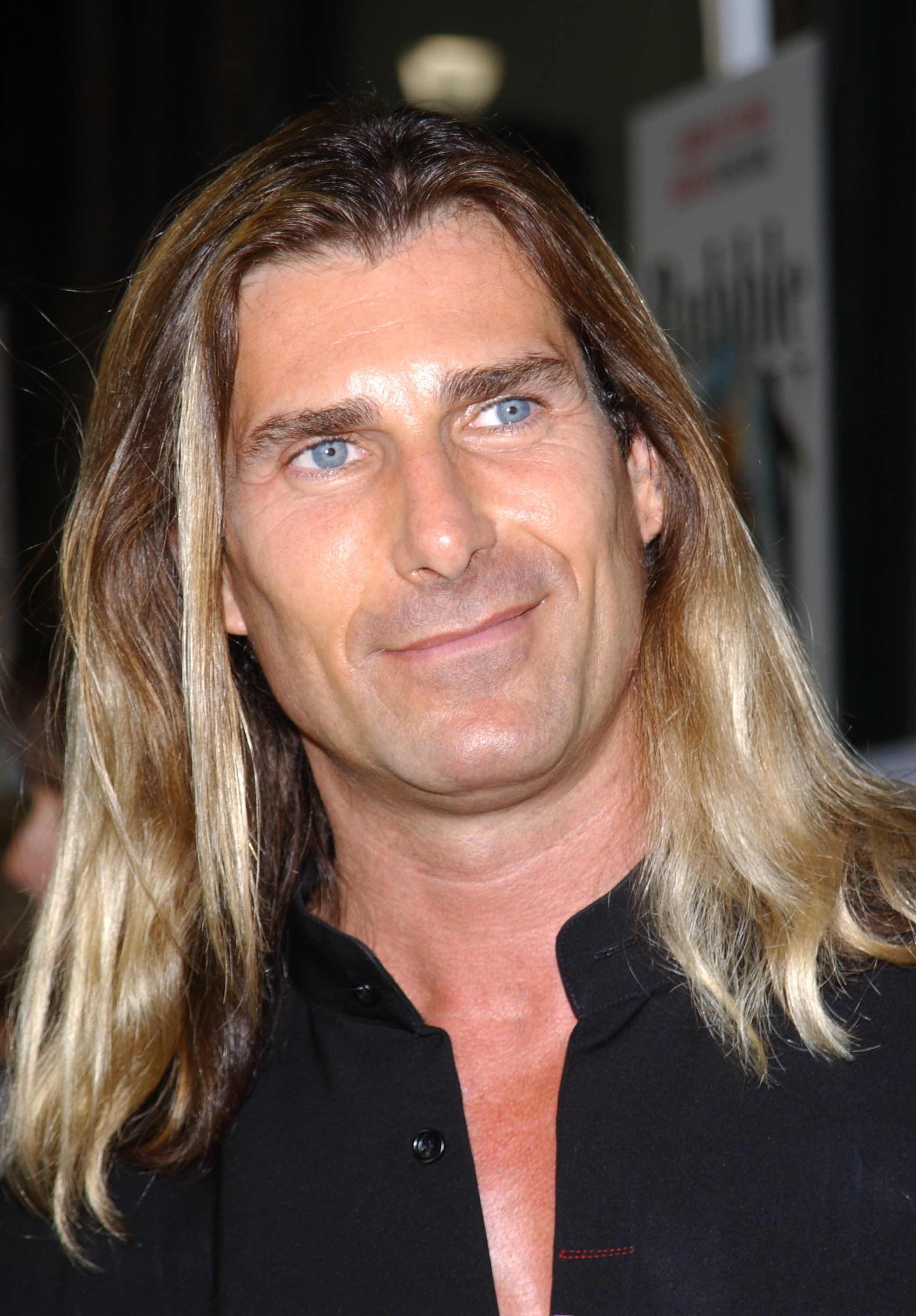 George Clooney later admitted that he wouldn't have stood a chance in a real fight. In this photo, Fabio attended the premiere of the film "Bubble Boy" in Hollywood, California, on August 23, 2001. | Source: Getty Images