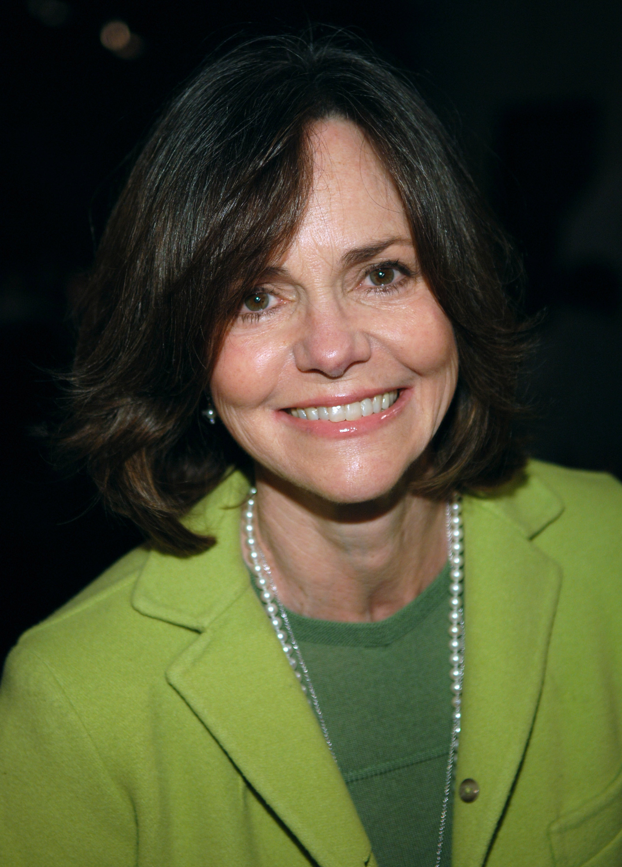 Sally Field on the red carpet at Wadsworth Theatre in Los Angeles, California, for Eve Ensler’s "The Good Body" opening night benefit for V-Day. She pairs varying shades of green with her signature pearl necklace, and though her eyes reflect the passage of time, her beauty still shines through.