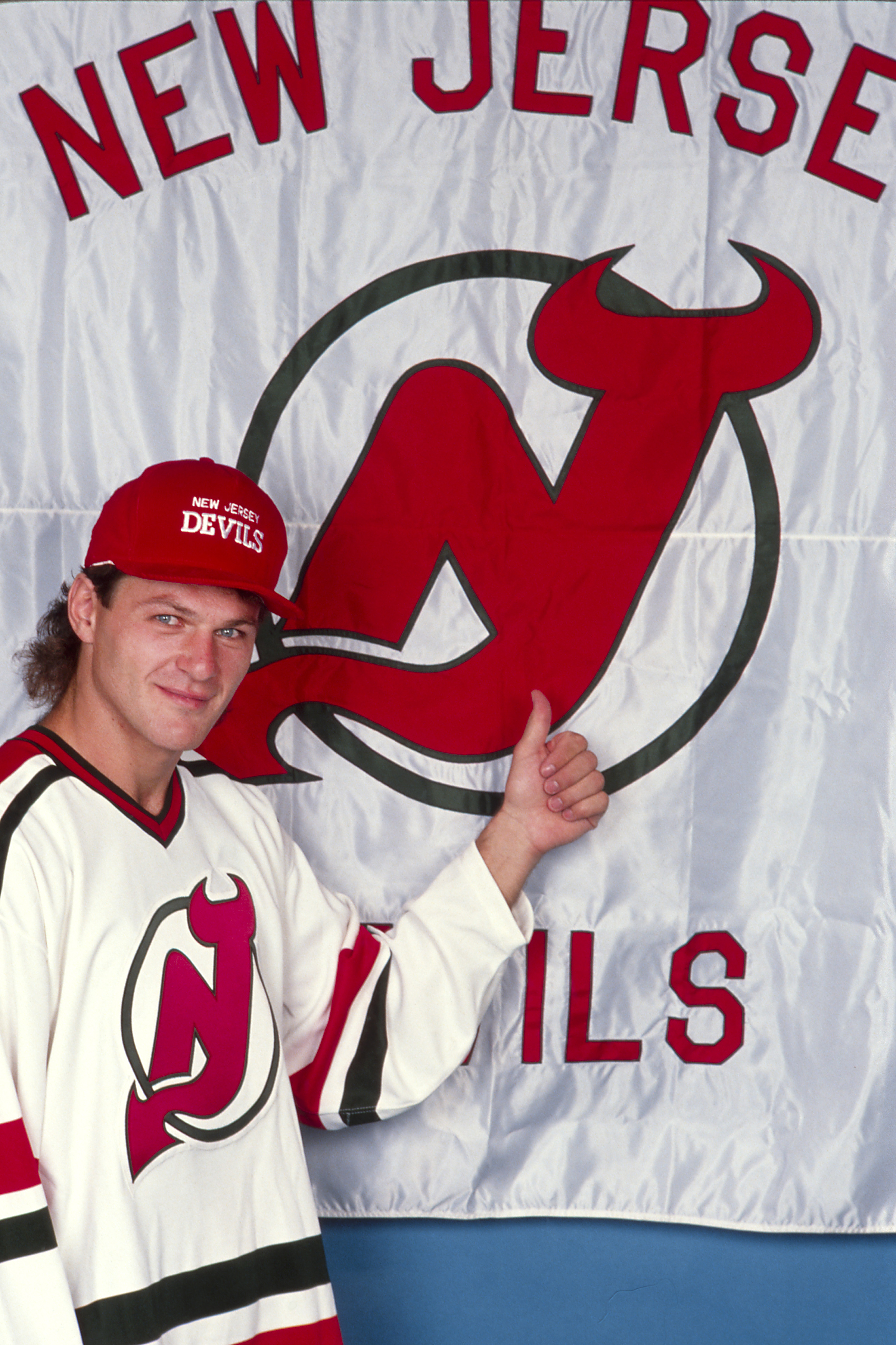 Forward Claude Lemieux #22 of the New Jersey Devils gives a thumbs up on his signing day at the Meadowlands Arena in East Rutherford, New Jersey. | Source: Getty Images