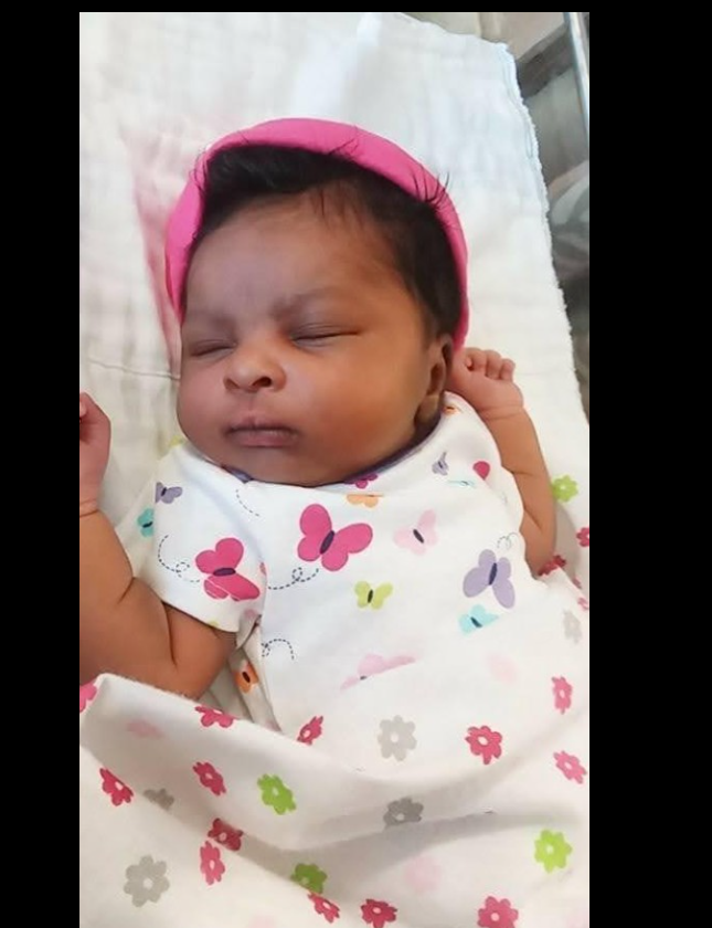 A gentle close-up of one of Shamar Elkins’s children shows the baby resting peacefully, eyes closed and wrapped in a soft blanket with delicate patterns. | Source: Facebook/Denise.