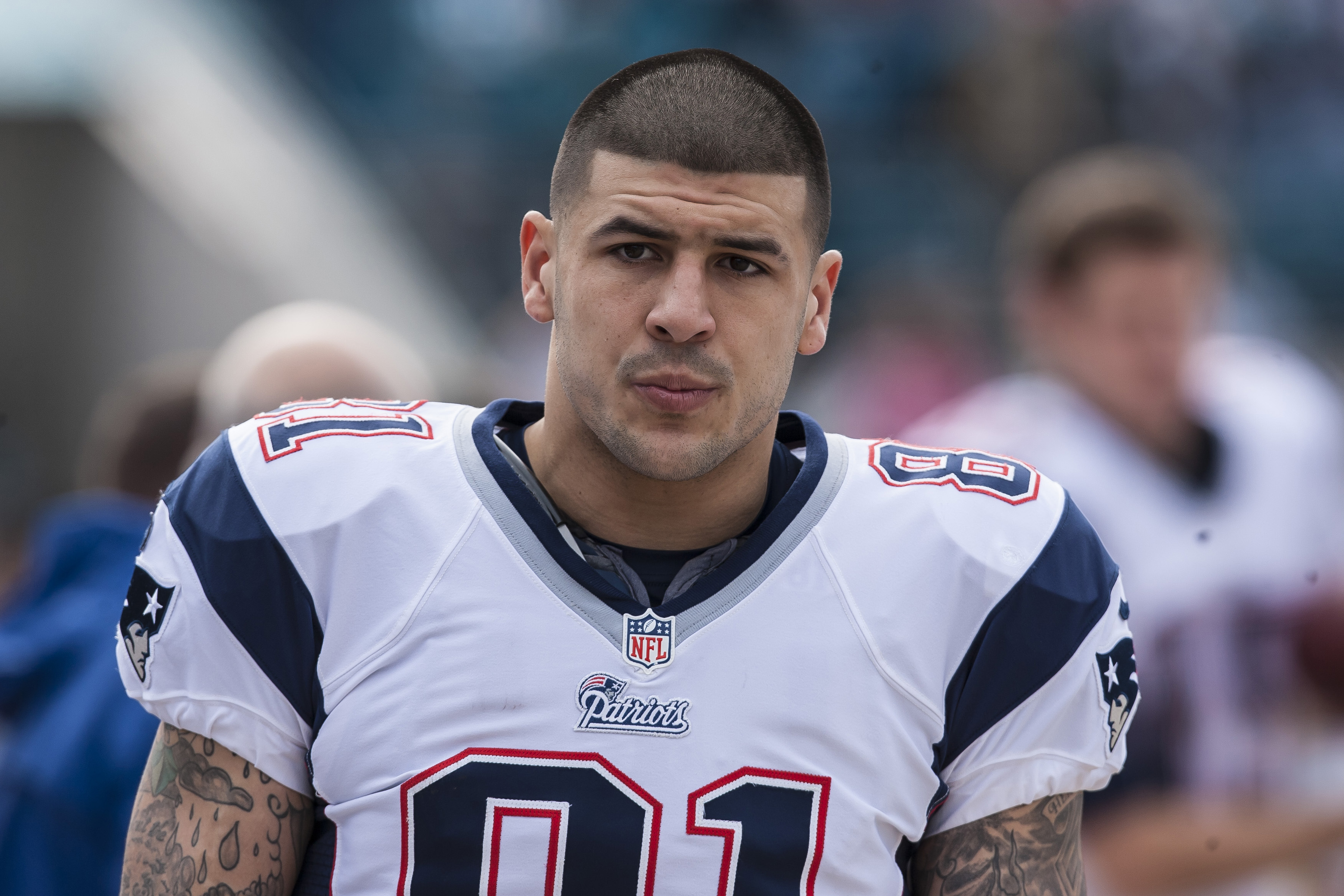 Aaron Hernandez watched from the field as the New England Patriots faced the Jacksonville Jaguars at EverBank Field in Jacksonville, Florida, on December 23, 2012, less than two months after becoming a father. Wearing his No. 81 jersey, Aaron was photographed during a period when football and parenthood were closely intertwined in his life. He had described Avielle Hernandez's arrival as a "life changer," saying that having a daughter gave him a new reason to approach life differently.