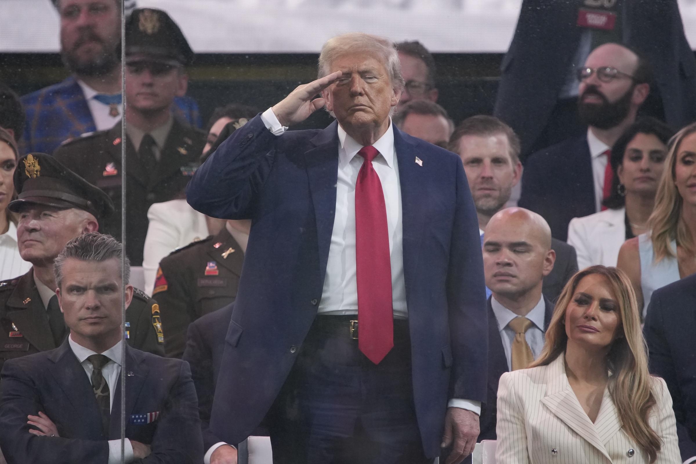 Donald Trump salutes as members of the U.S Army participate in the 250th birthday parade of the U.S. Army in Washington, DC | Source: Getty Images