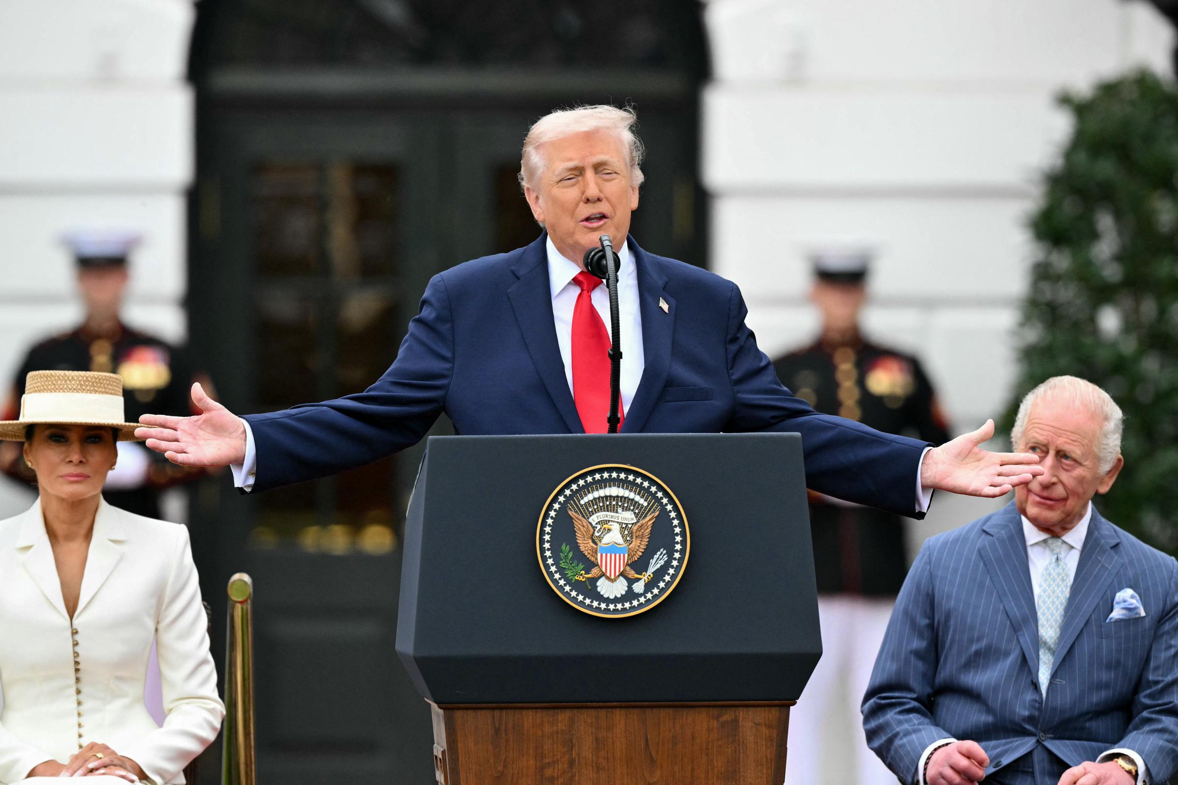 Donald Trump speaks as Melania and King Charles III look on during an arrival ceremony on the South Lawn of the White House on April 28, 2026 | Source: Getty Images