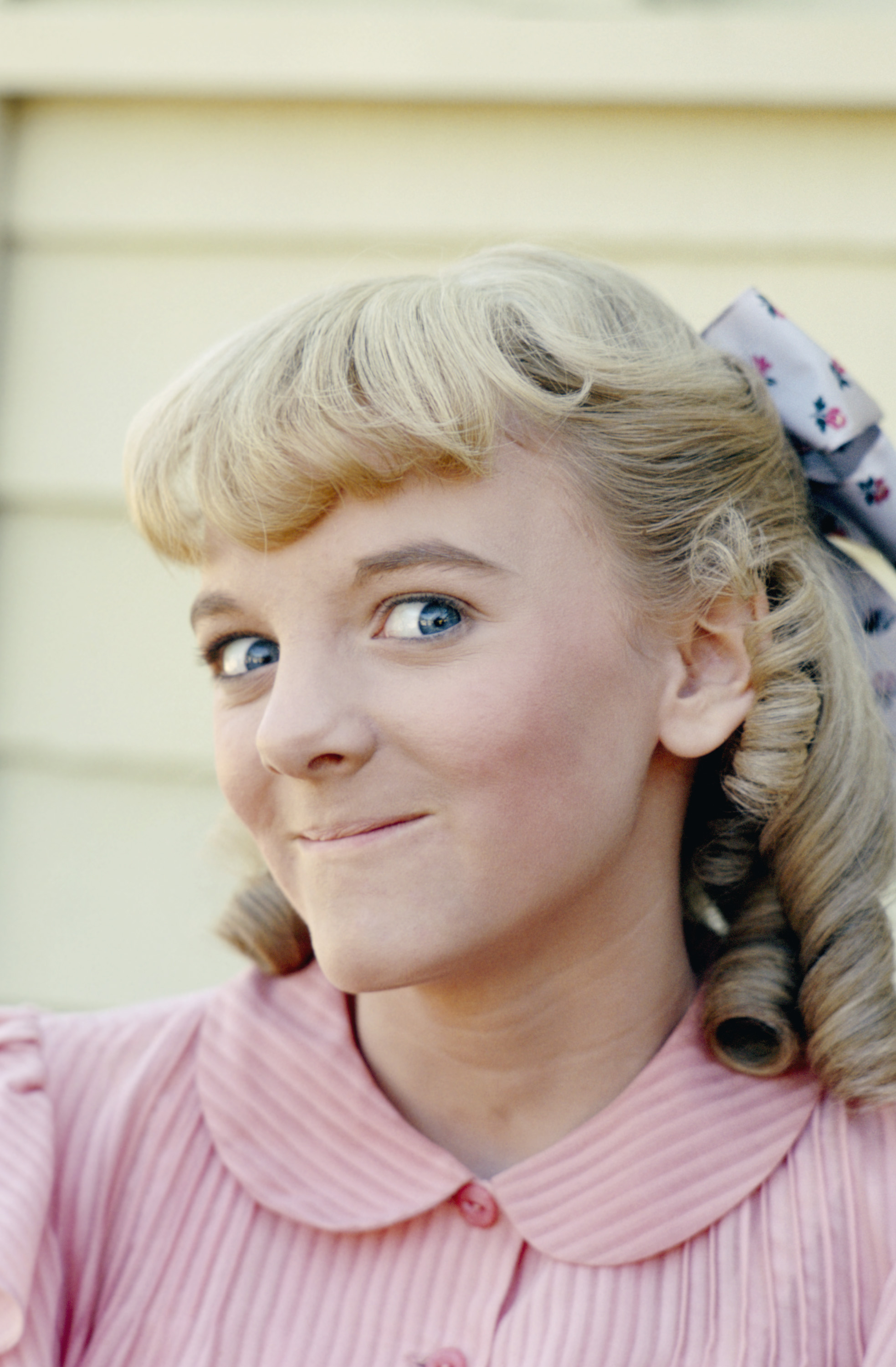 Nellie's wide-eyed look became one of the character's trademarks, often signaling that another scheme was about to unfold. The playful expression helped make her one of television's most unforgettable young villains. | Source: Getty Images