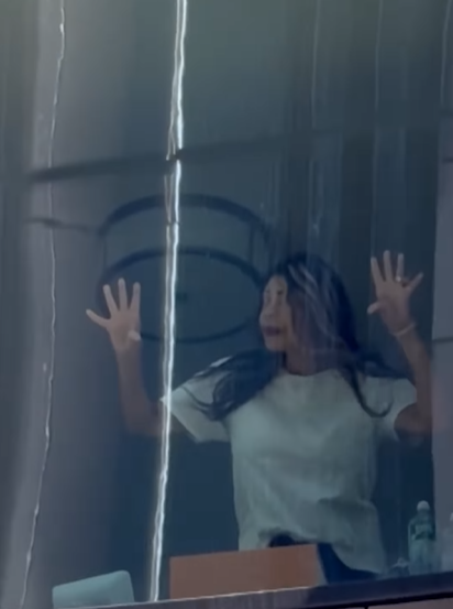 Wendy Williams presses her hands against the window, looking outward, posted on March 19, 2025 | Source: Instagram/tmz_tv