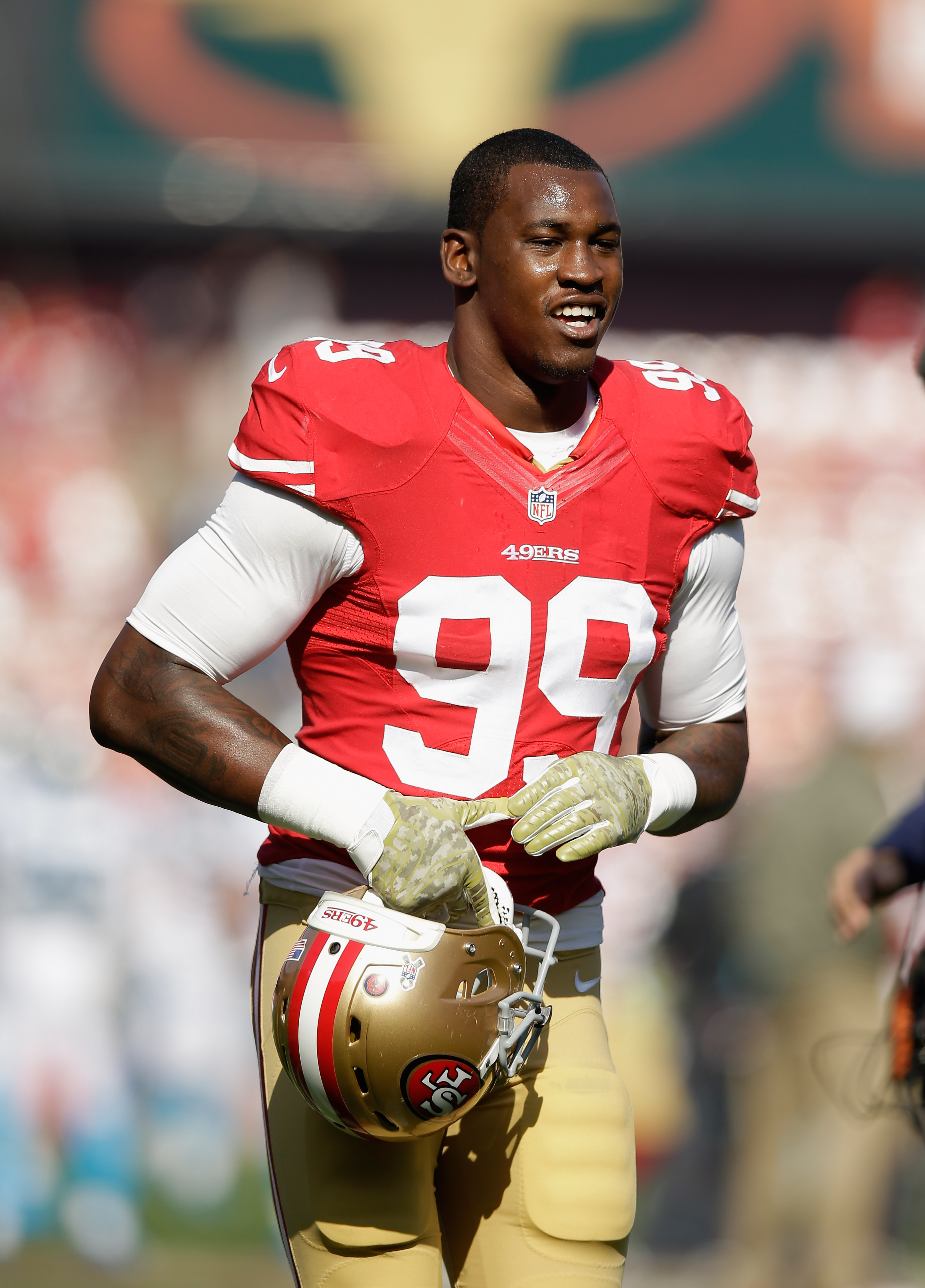 Aldon Smith #99 of the San Francisco 49ers warms up before their game against the Carolina Panthers on November 10, 2013 | Source: Getty Images