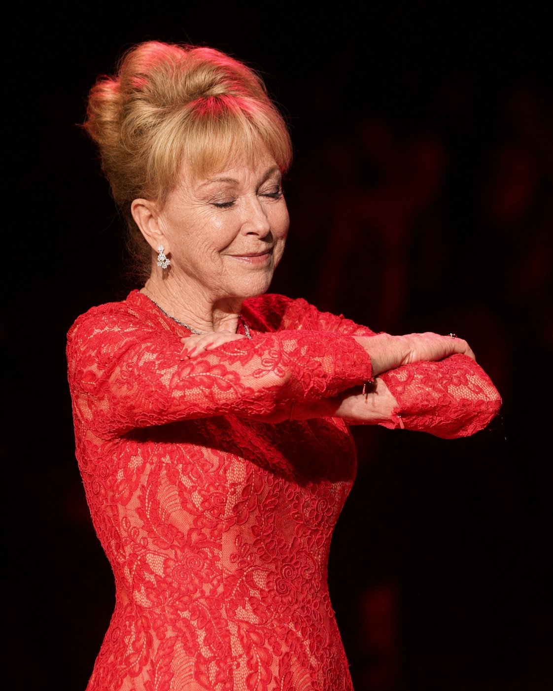 A digitally created portrait reimagines Barbara Eden with naturally aged facial features as she performs her signature crossed-arms pose, a nod to her iconic role as Jeannie. | Source: ChatGPT