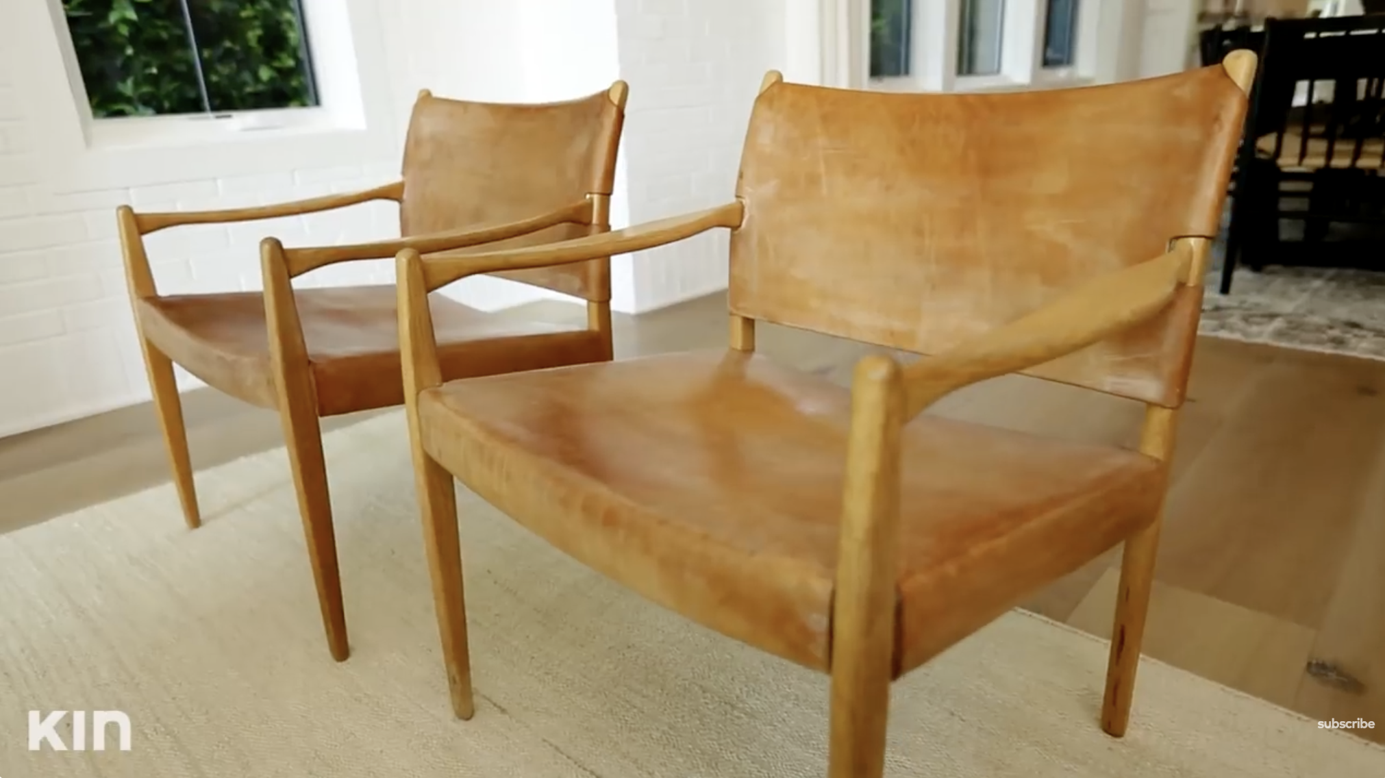 Two leather armchairs situated in Tia Mowry's living room. | Source: YouTube/Tia Mowry's Quick Fix