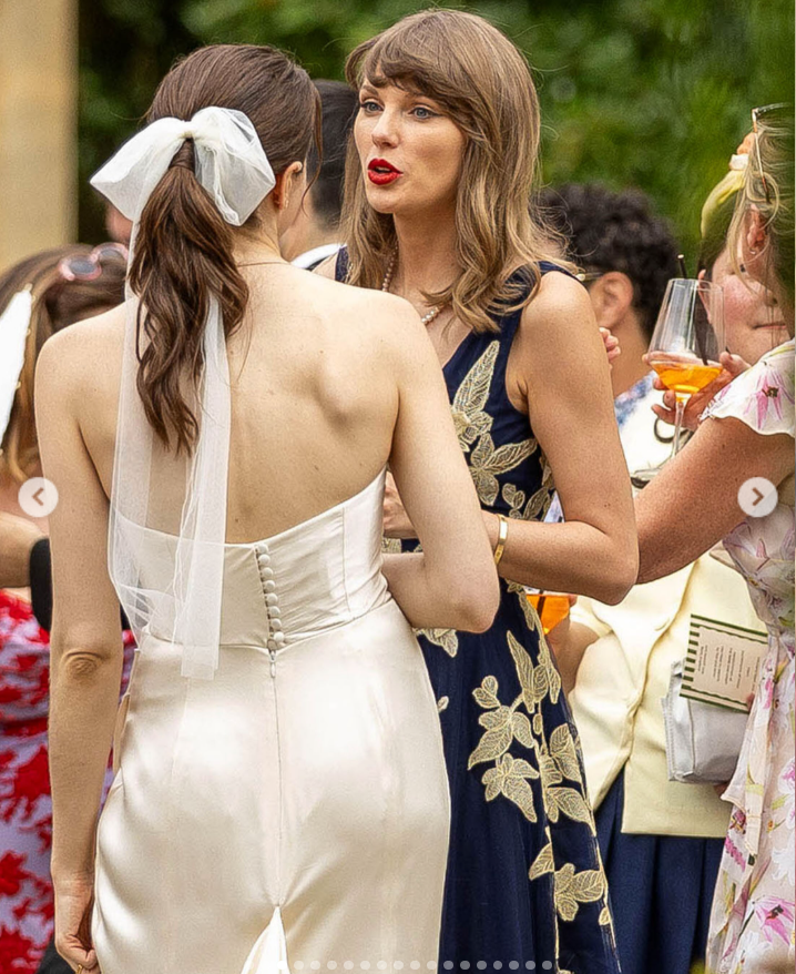 As a wedding guest at the English wedding of Oli Jacobs and Laura Sisk in Gloucestershire, England, Taylor Swift showcased her new shoulder-length hairstyle with soft waves. | Source: Instagram/deuxmoi