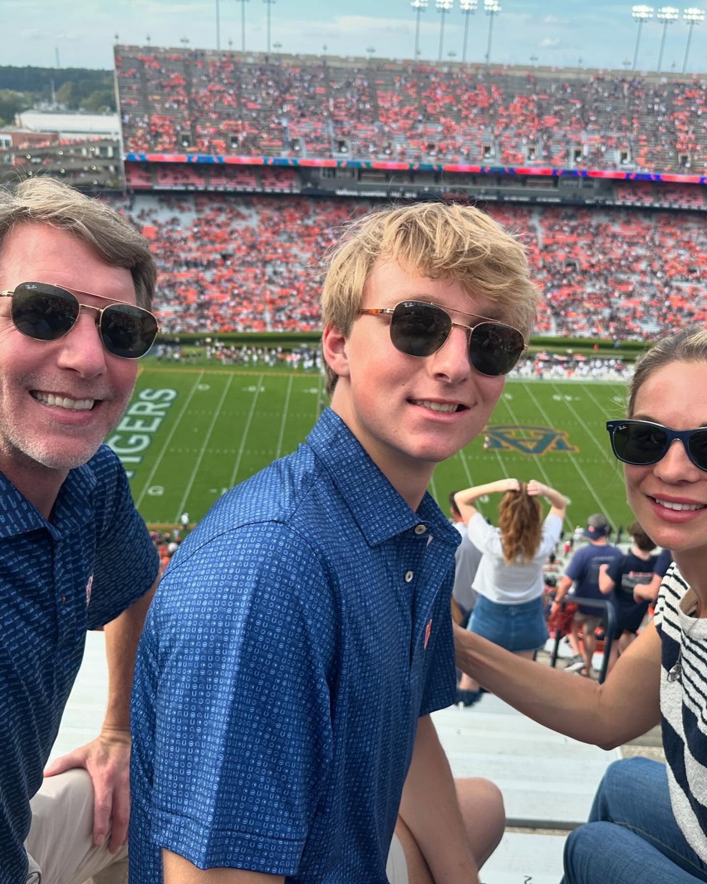 Justin "Weston" Higginbotham and his prents had no idea that their last trip ogether would end in tragedy. Here they are at a football game at Auburn University on November 3, 2024 | Source: Facebook/Nancy Higginbotham