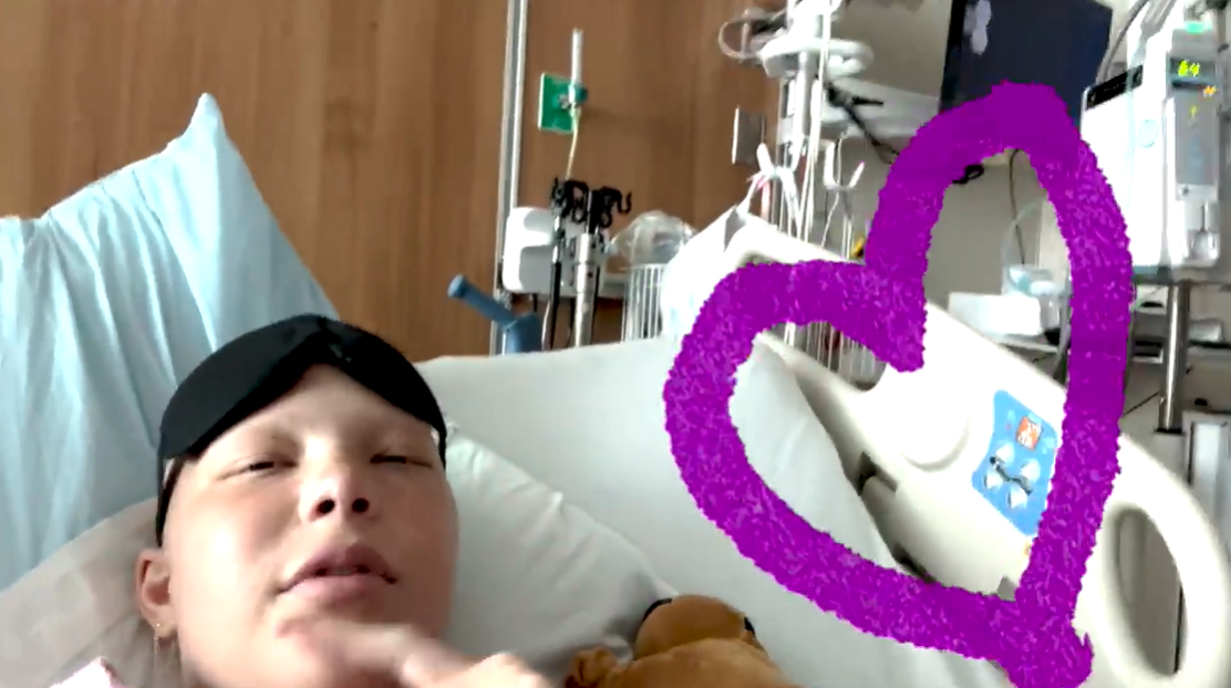 Resting in her hospital bed, Isabella Strahan shares a candid vlog update ahead of her final chemotherapy round, as posted on June 15, 2024 | Source: YouTube/IsabellaStrahan
