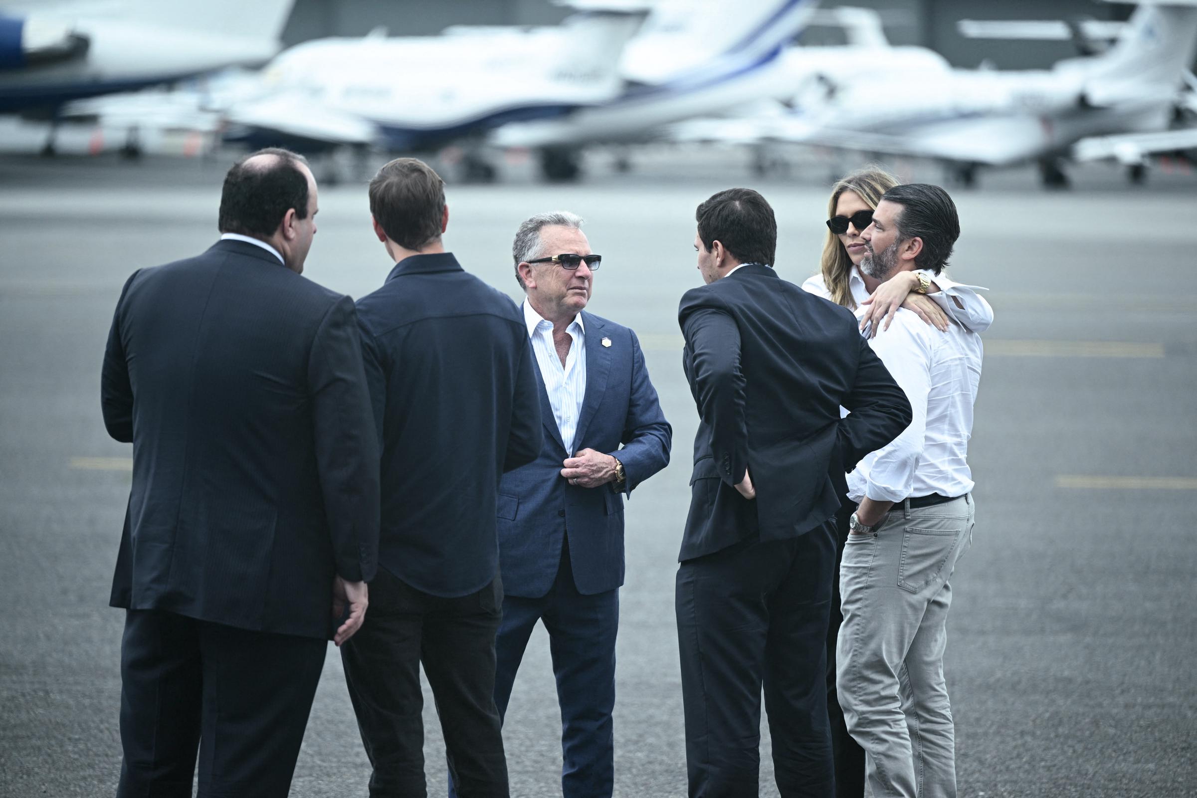 Donald Trump Jr. hugs Bettina Anderson next to Michael Boulos, Steve Witkoff, Jared Kushner, and Boris Epshteyn at Teterboro Airport on July 13, 2025, in Teterboro, New Jersey, ahead of the FIFA Club World Cup final at MetLife Stadium | Source: Getty Images
