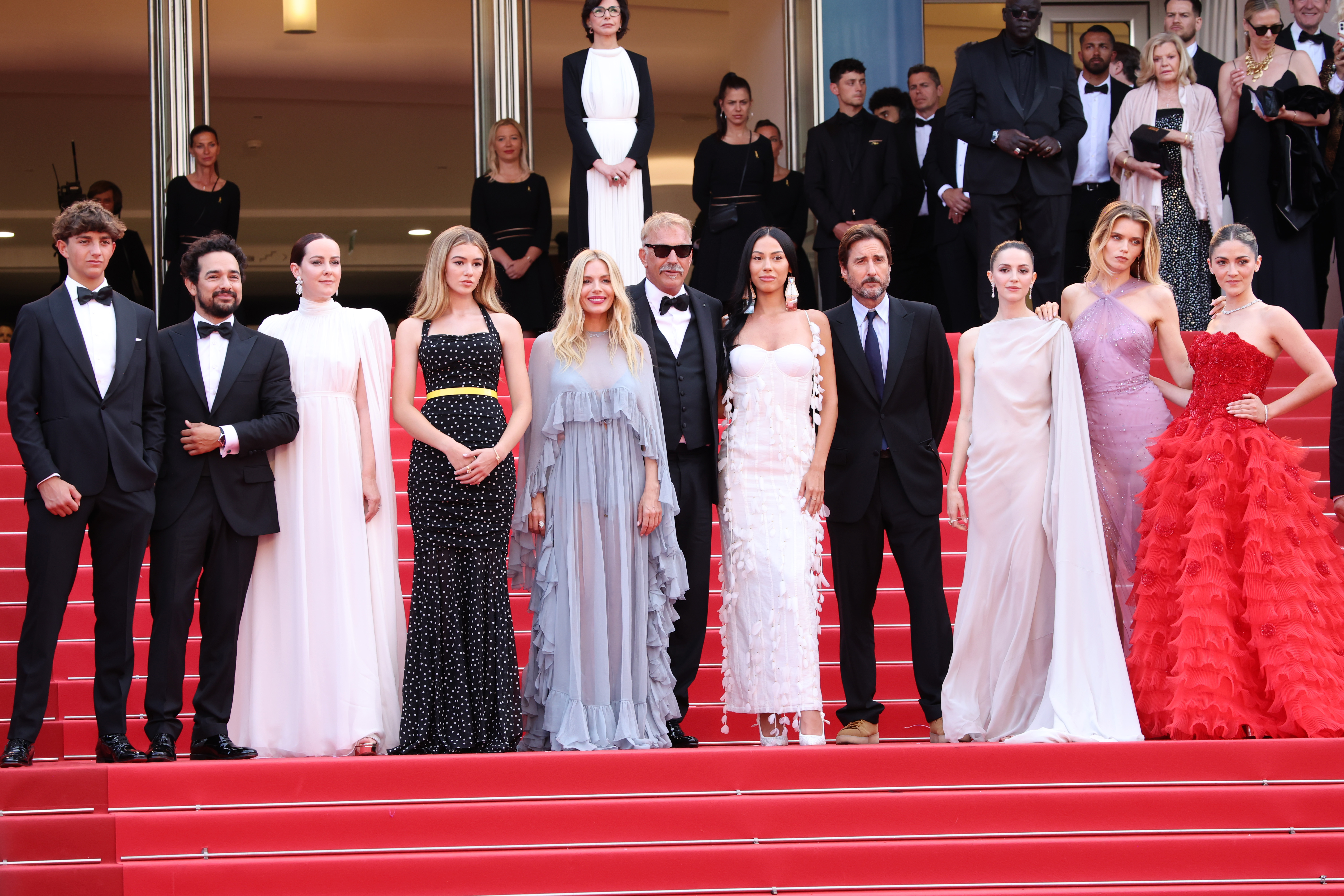 Hayes Costner, Alejandro Edda, Jena Malone, Georgia MacPhail, Sienna Miller, Kevin Costner, Wasé Chief, Luke Wilson, Ella Hunt, Abbey Lee Kershaw, and Isabelle Fuhrman attend the "Horizon: An American Saga" Red Carpet at the 77th annual Cannes Film Festival at Palais des Festivals in Cannes, France, on May 19, 2024 | Source: Getty Images