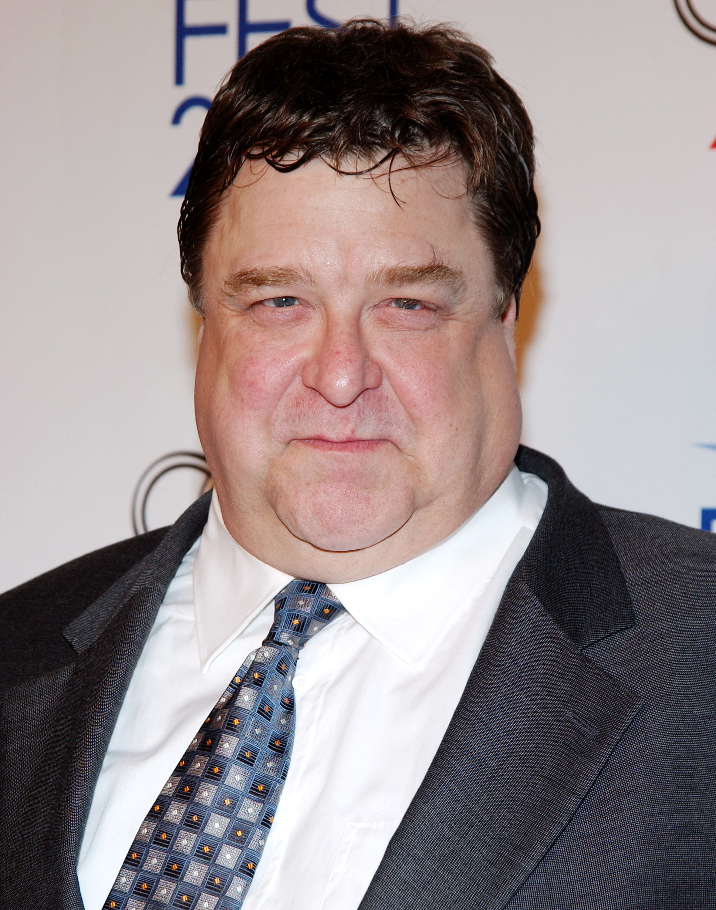 Goodman attended the 2004 "Beyond the Sea" premiere in Hollywood, wearing a dark suit and patterned tie. The photo shows his fuller appearance before his major weight loss. | Source: Getty Images