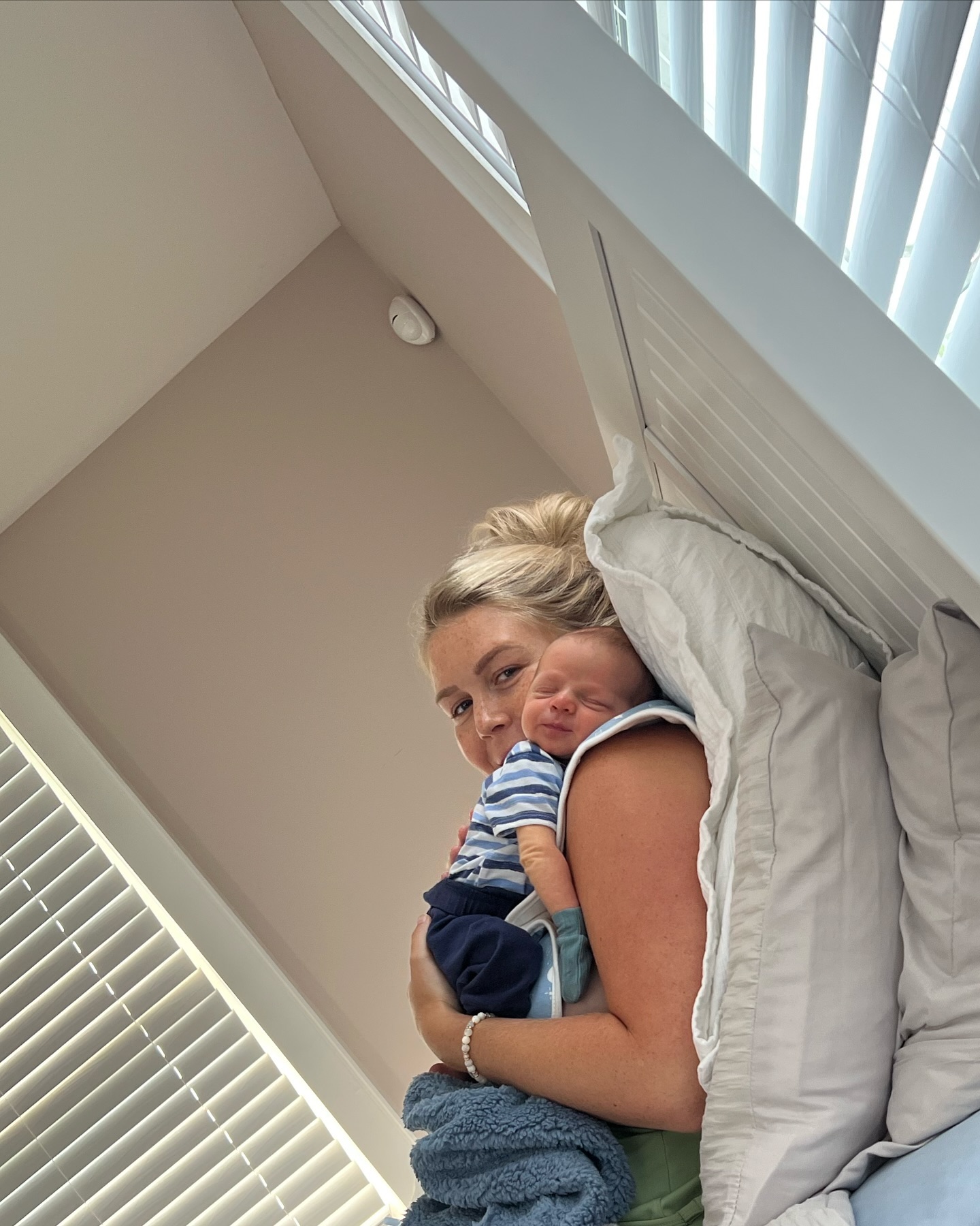 This quiet newborn moment puts the home's soft neutral palette front and center, with white bedding and abundant natural light surrounding mother and baby. It is almost the visual opposite of the crowded briefing room where Leavitt spent so much of her professional life. | Source: Instagram/karolineleavitt