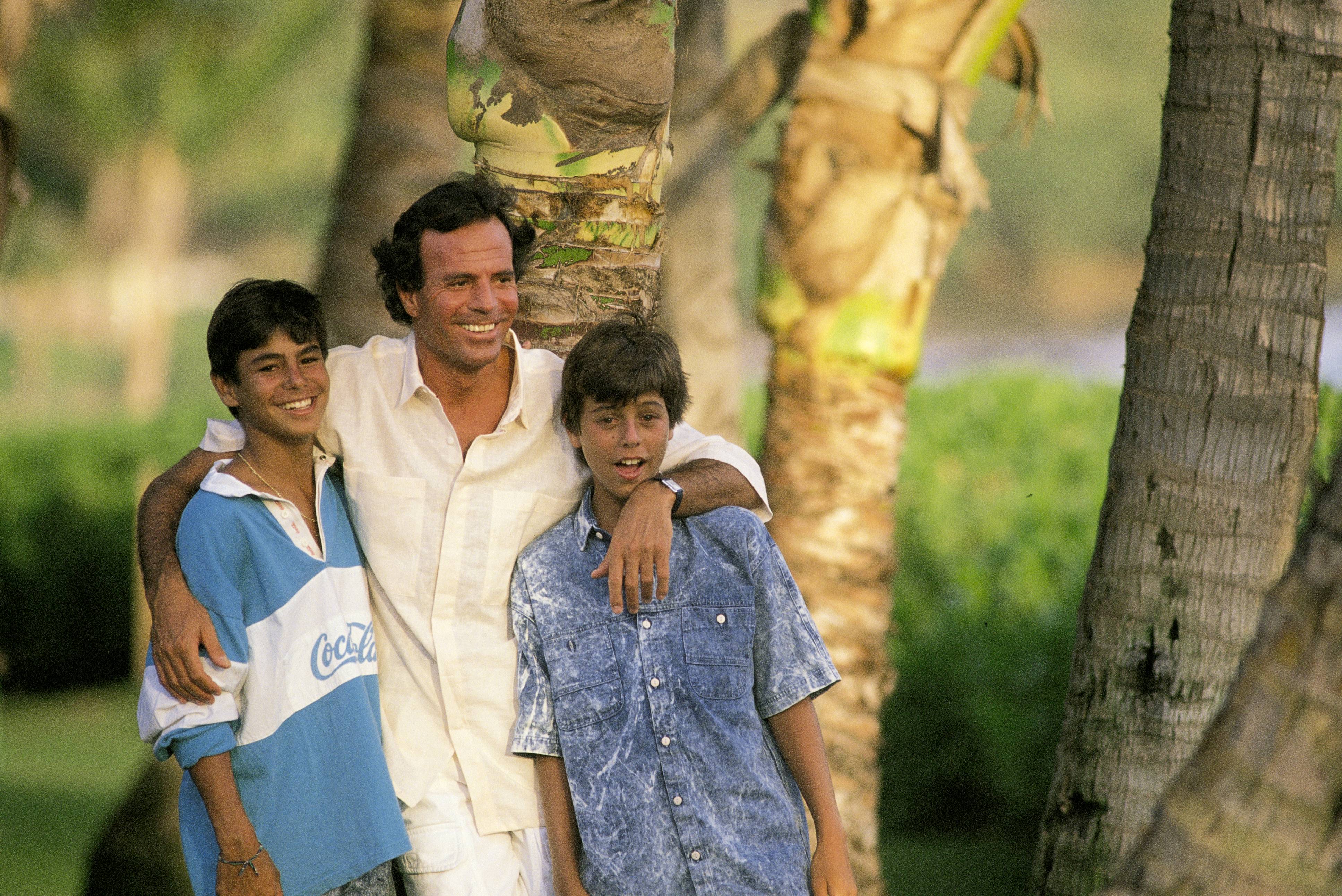 Julio Iglesias with his sons Enrique and Julio Jose in Hawaii in an undated photo | Source: Getty Images