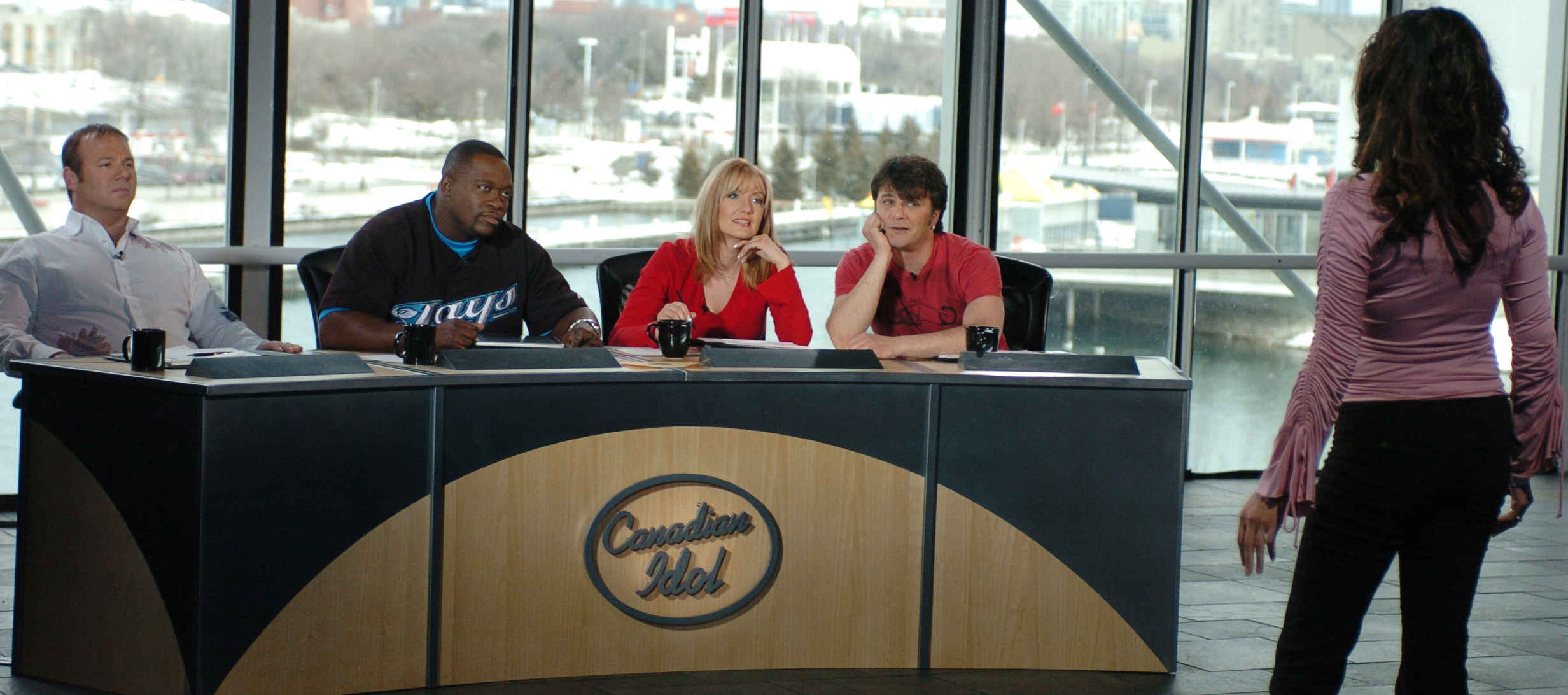 Sass Jordan joins fellow judges during Canadian Idol auditions in Toronto in 2004. She served as a judge for all six seasons of the competition, where contestants, including Mikey Bustos, later remembered her encouragement and support. | Source: Getty Images
