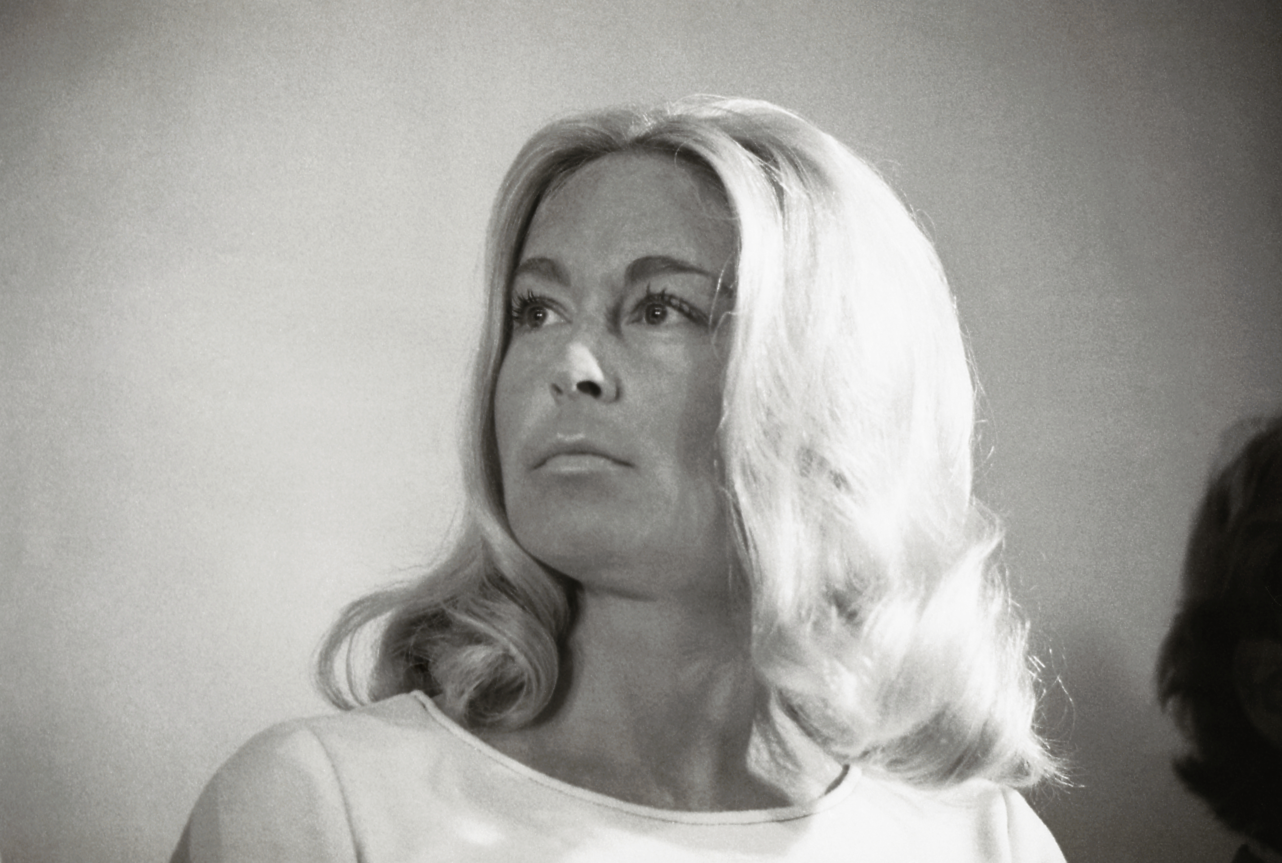 Joan Kennedy looks on during a portrait unveiling of her late brother-in-law Robert F. Kennedy in 1975. | Source: Getty Images