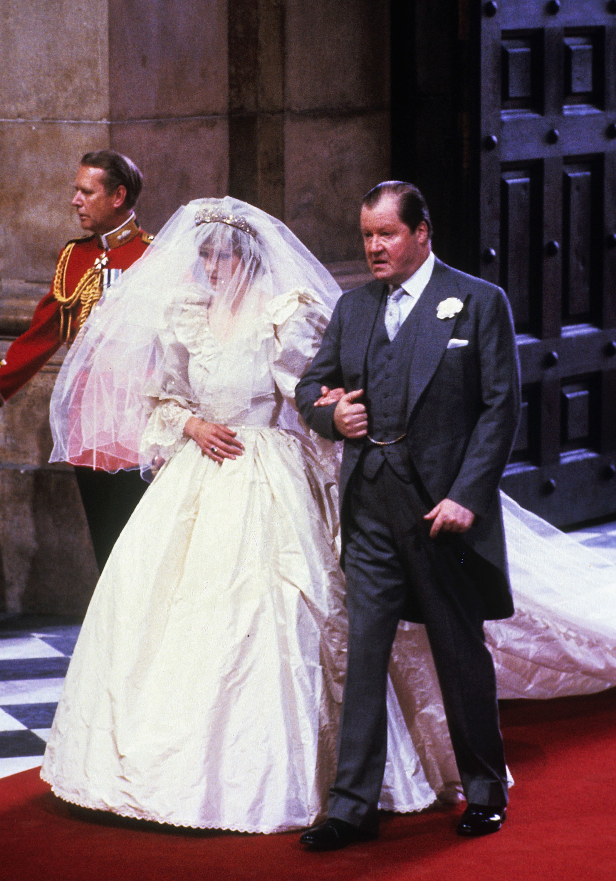 The late Princess Diana walking down the aisle with her late father, John Spencer, on her wedding day in London, England on July 29, 1981. | Source: Getty Images