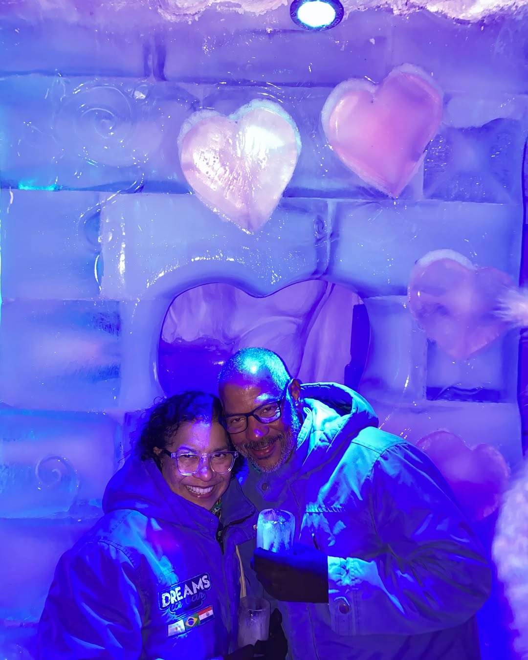 Juliana Marins' parents posing in front of an ice structure, from a post dated May 27, 2025 | Source: Instagram/ajulianamarins