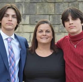 Meghan Metcalf pictured with her twins, Hunter and Austin, from a post dated October 2022 | Source: Facebook/meghan.p.metcalf