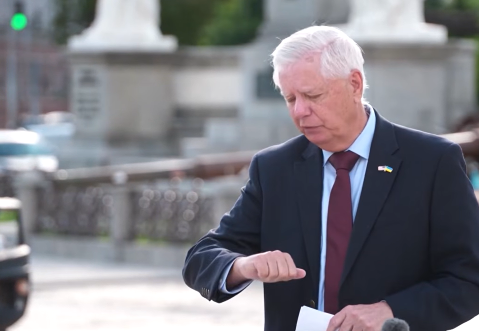 Standing before reporters after meetings in Ukraine, Lindsey Graham delivers an update on negotiations, announcing that lawmakers and the White House had reached agreement on a version of a bipartisan Russian sanctions bill. | Source: YouTube/APT